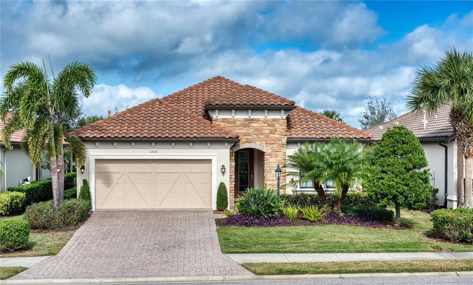 Discover effortless luxury in this beautifully maintained Piceno model located in the sought-after, resort-style community of Esplanade at Lakewood Ranch. This exceptional 2-bedroom, 2-bath home also features a versatile den—perfect as a third bedroom, home office, or flex space to fit your lifestyle.

Step inside to an open-concept living area designed for both comfort and style. The gourmet kitchen impresses with solid wood cabinetry, granite countertops, stainless steel appliances, a walk-in pantry, and a built-in desk—ideal for staying organized. Tray ceilings with crown molding, luxury vinyl flooring, and plantation shutters elevate the home’s sophisticated appeal.

The spacious primary suite is a private sanctuary, complete with a bay window sitting area, dual walk-in closets, and a spa-inspired bathroom featuring split vanities, a walk-in shower, and a private water closet. A well-appointed laundry room with extra storage and counter space adds convenience.

Enjoy Florida living at its finest on the screened lanai, perfect for relaxing or entertaining, with your own outdoor kitchen ready for grilling.  Secluded private back yard is a perfect setting for coffee and relaxation and has additional room to personalize to your satisfaction.  Additional upgrades include seamless gutters, an epoxy-coated garage floor, and a paver driveway for stunning curb appeal.

Living in Esplanade means every day feels like a vacation. This premier 18-hole golf community offers world-class amenities: two clubhouses, resort-style pools, a resistance pool, tennis and pickleball courts, a state-of-the-art fitness center, and onsite dining at the Barrel House Bistro Bar and the poolside Bahama Bar. Pamper yourself at the Koquina Salon, offering everything from hair services to massages and facials.

Located in Lakewood Ranch—the nation’s #1 multi-generational master-planned community—this home offers an unmatched blend of luxury, convenience, and lifestyle. Enjoy low-maintenance living surrounded by lush landscaping and just minutes from top-tier shopping, dining, and entertainment in Lakewood Ranch and Sarasota.

Don’t miss your chance to experience resort-style living in one of Florida’s most vibrant communities.