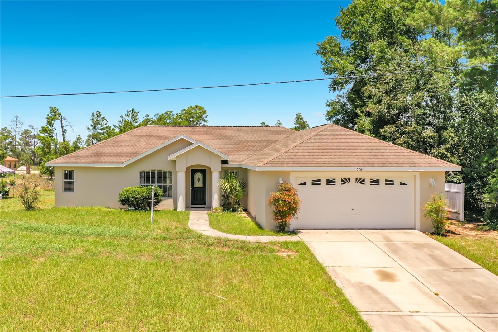 Move-in ready 3-bedroom, 2-bath home in desirable SW Ocala with great square footage, a split-bedroom floor plan, and a 2-car garage. Inside, you'll find brand-new luxury vinyl plank flooring throughout, tile in the kitchen and bathrooms, new stainless steel kitchen appliances, abundant cabinet space, an eat-in kitchen, spacious living room, separate family room, and a formal dining room that also makes an ideal home office or flex space. The private primary suite features tray ceilings, a garden tub, and a separate shower. An indoor laundry room and screened lanai add everyday comfort and convenience. Located in popular SW Ocala, this home offers quick access to I-75, the Florida Aquatics Swimming & Training (FAST) center, Market Street at Heath Brook, the Ocala Downtown Square, hospitals, shopping, restaurants, grocery stores, and the World Equestrian Center. You'll also enjoy nearby parks, the Florida Greenway trails, and an easy commute throughout Central Florida. With its spacious layout, modern updates, and exceptional location, this home is one you won't want to miss!