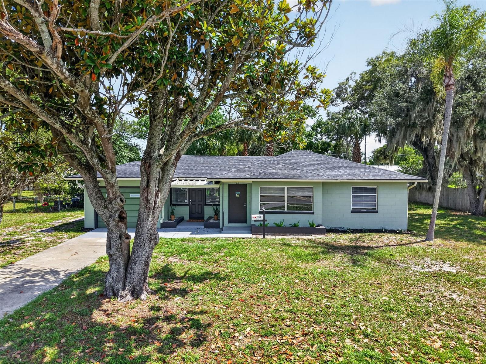 Welcome home to this charming Mount Dora residence, where classic character meets thoughtful updates. Situated on a spacious 1/3-acre lot in an established neighborhood with no HOA, this move-in-ready home offers comfort & convenience. 

Step inside to discover beautifully refinished original wood floors that bring warmth and character to the living spaces. Natural light fills the home, creating a bright and inviting atmosphere throughout. A brand-new roof, just one year old, provides added peace of mind for years to come.

The kitchen features abundant cabinet storage and plenty of room for a cozy breakfast table, creating the perfect spot for morning coffee or casual dining. Just beyond, the living area and versatile bonus/flex room offer comfortable, adaptable spaces ideal for relaxing, entertaining, working from home, or pursuing hobbies.

The generously sized bedrooms and functional floor plan provide flexibility to fit a variety of lifestyles. Sliding glass doors lead to a screened rear porch overlooking the expansive backyard, offering plenty of space for gardening, recreation, pets, or future outdoor enhancements. Located in unincorporated Lake County, this property benefits from county-only taxes and a septic system, helping reduce monthly expenses. Additional updates include a tankless hot water heater installed just three years ago.

Ideally located close to school and amenities and just minutes from historic downtown Mount Dora, you'll enjoy easy access to waterfront parks, unique shops, local restaurants, year-round festivals, and entertainment. Whether you're searching for a primary residence, seasonal retreat, or investment opportunity, this delightful home combines classic charm, modern updates, and an unbeatable location.