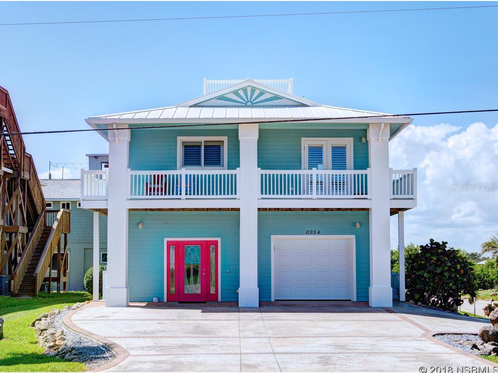 This Beautifully Cared for Immaculate Key West Style Home has been beautifully renovated and has Non-Exclusive Deeded Easement Access to Dock. 2nd and 3rd Floor has beautiful sunsets from your balconies. Has wrap around porches,  etched glass that has coastal theme. Exterior Hardi Board siding, custom kitchen cabinets with under cabinet lighting, Granite counter tops, Tumbled Marble back splash, and Stainless Steel appliances. Flooring Bamboo upstairs and Travertine tile downstairs with Custom Dolphins inlays, Custom Crown Molding, living room and family room are wired for surround sound, Plantation Shutters throughout, ceiling fans in bedrooms, living room and family room, outside speakers on all levels. Circular staircase to the rooftop is Powder Coated Aluminum, Double pane tinted windows, Insulated Aluminum Garage Door with door opener, 4 zones Sprinkler system, hot tub on the lower back deck. ;Water: City