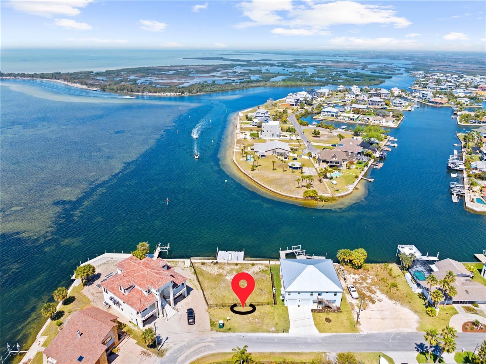 Rare Gulf-front vacant lot on a quiet cul-de-sac in Hernando Beach! Discover the perfect opportunity to build your dream waterfront home on this .18-acre Gulf-front lot in the desirable community of Hernando Beach! Offering STUNNING GULF VIEWS and DIRECT GULF ACCESS, this property is a gateway to the ultimate Florida coastal lifestyle. Highlights include a 24x34 FLOATING PONTOON DOCK, perfect for boating and water activities, and a new 100-FT SEAWALL, ensuring long-term durability and security. The lot is FULLY FENCED for added privacy and convenience, with WATER ALREADY CONNECTED for easy utility access. Located just a SHORT BOAT RIDE TO THE FLATS, this property is a haven for fishing and leisure enthusiasts. Enjoy the nearby restaurants, live music, and attractions like the Weeki Wachee River, all while embracing the serene beauty of Gulf-front living. This is your chance to own a piece of paradise—don’t miss the opportunity to make your waterfront dreams a reality!