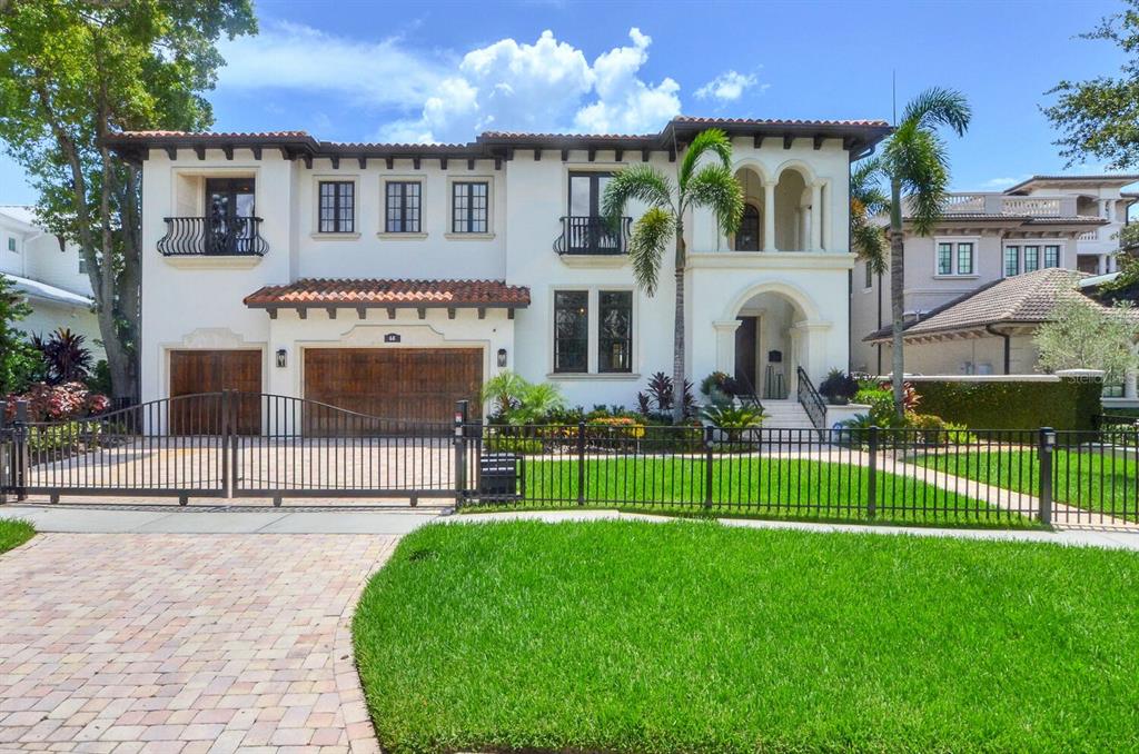 Welcome to 68 Bahama Circle, a luxurious Davis Island waterfront estate with partial Open Bay views of beautiful Tampa Bay. This Mediterranean-inspired home boasts a spacious and inviting open floor plan that captures year-round Florida sunlight and sparkling views of the Bay. Spanning more than 7600 square feet, the home includes 6 bedrooms, 7 full baths, 3-car garage, spacious media room, and a temperature-controlled wine cellar. Culinarians would love this chef's kitchen with Butler's pantry, walk-in pantry, multi-functional island and top-of-the-line GE Monogram appliances. In fact, designer details abound, from the handcrafted wooden doors and beamed ceilings, to the marble floors, wrought iron staircase and elegant appointments. Up the staircase you’ll find beautiful hardwood floors leading to the main bedrooms and media room. Retreat to your Master bedroom with open bay views and relish in the warmth and comfort within, or grab a book and beverage and enjoy the moment in your private sitting area. Outdoors, enjoy breathtaking open Bay views while soaking in the sun by the pool, spa or along the expansive patio. An outdoor kitchen, balcony views and dock with davits completes the package. This home is gated for privacy and surrounded by lush greenery and landscaping. Enjoy Davis Island living on one of the most prestigious streets on the island. It is a Must See!!