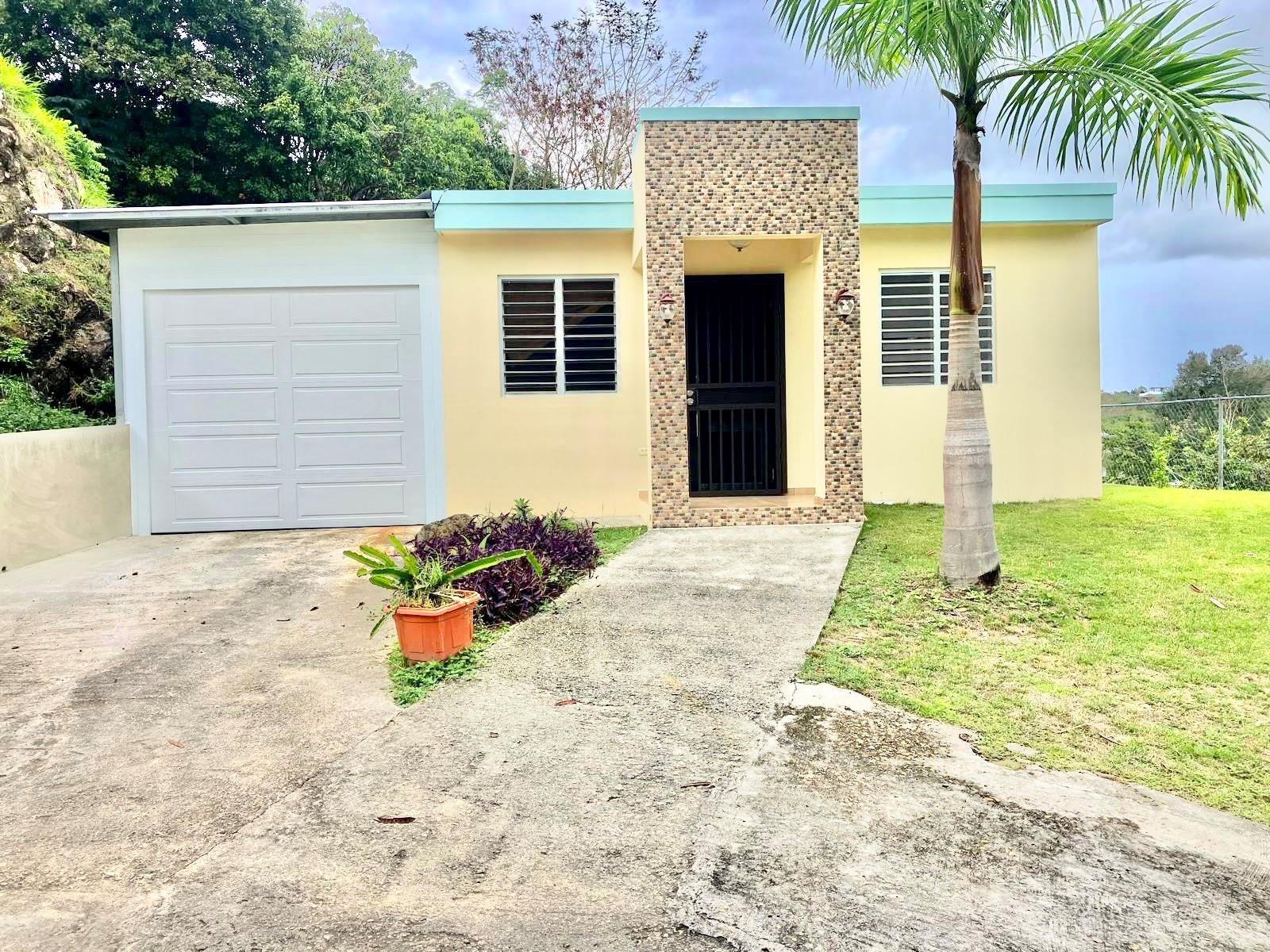 Located in the charming and authentic neighborhood of Barrio Cruces in Rincón, this cozy 3-bedroom, 2-bath single-family home offers comfort, privacy, and everyday convenience in one of Puerto Rico’s most desirable beach towns. Priced to sell, this property presents an excellent opportunity for families, newcomers to the area, or buyers looking for a well-located home with value and potential. The property sits on a natural bluff, allowing for refreshing island breezes and an elevated outdoor setting. The outdoor patio provides a great opportunity to create your own retreat, with space suitable for a small plunge pool, garden seating, or outdoor lounge area to enjoy Rincón’s relaxed lifestyle.
Situated on a quiet dead-end road, the home offers a peaceful residential setting while remaining just a short 7-minute drive to Rincón’s beaches and town plaza. The practical layout includes 3 bedrooms and 2 bathrooms, a carport for two vehicles, a dedicated laundry room, and a fully fenced yard ideal for privacy, pets, or outdoor enjoyment.Additional features include a septic system and a transfer switch installed for generator connection, adding convenience and preparedness. Barrio Cruces is known for its local charm and friendly residential atmosphere, with bakeries, hardware stores, and everyday amenities nearby, making daily living easy while still enjoying the laid-back lifestyle that makes Rincón so special. Whether you're looking for a comfortable primary residence, a cozy home to relocate to Rincón, or a well-priced opportunity in a desirable zip code, this property offers a welcoming place to settle in and make your own.