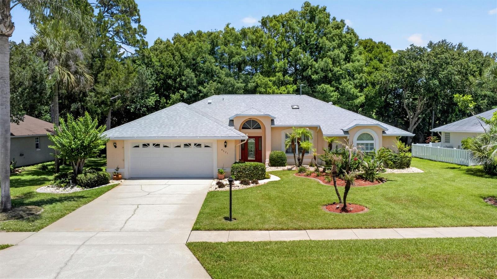 Bright, open, and beautifully maintained, this home offers the perfect blend of comfort and Florida living. Spectacular pocketing (cavity) sliding glass doors open the living area to the outdoors, filling the home with natural light. The open-concept floor plan features luxury vinyl plank flooring, plantation shutters, and a spacious kitchen with solid wood soft-close cabinetry, pull-out drawers, breakfast bar, and room for an island or breakfast table. The split-bedroom design provides privacy, while the primary suite includes a large walk-in closet, soaking tub, and separate shower. The third bedroom features a charming window seat with built-in storage. Inside laundry offers an oversized pantry, and the oversized garage includes pull-down attic storage. Enjoy a beautifully landscaped yard with irrigation, peaceful preserve and pond views, and the confidence of a high-and-dry homesite that has never flooded. Conveniently located just minutes from shopping, restaurants, parks, & more!