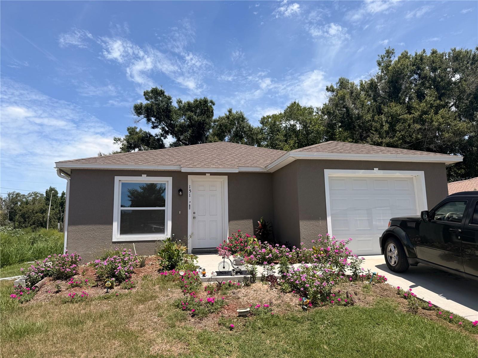 One or more photo(s) has been virtually staged. NO HOA !!!!! BUILT IN 2023 - Welcome to this beautifully maintained 3-bedroom, 2-bath home built in 2023. Situated at the end of a quiet dead-end street, this property offers a functional layout with an open-concept living area designed for comfortable everyday living and entertaining. The kitchen features granite countertops, a large breakfast bar, ample cabinet space, and a spacious pantry. The primary bedroom features en-suite and living areas are filled with natural light, creating a bright and inviting atmosphere throughout the home. Outside, enjoy a generously sized backyard with banana and mature trees providing shade and privacy, along with a storage shed for additional convenience. The attached one-car garage adds extra storage and parking flexibility. Conveniently located near shopping, dining, schools, major roadways, and the many amenities Winter Haven has to offer, this move-in-ready property presents an excellent opportunity for homeowners and investors alike.