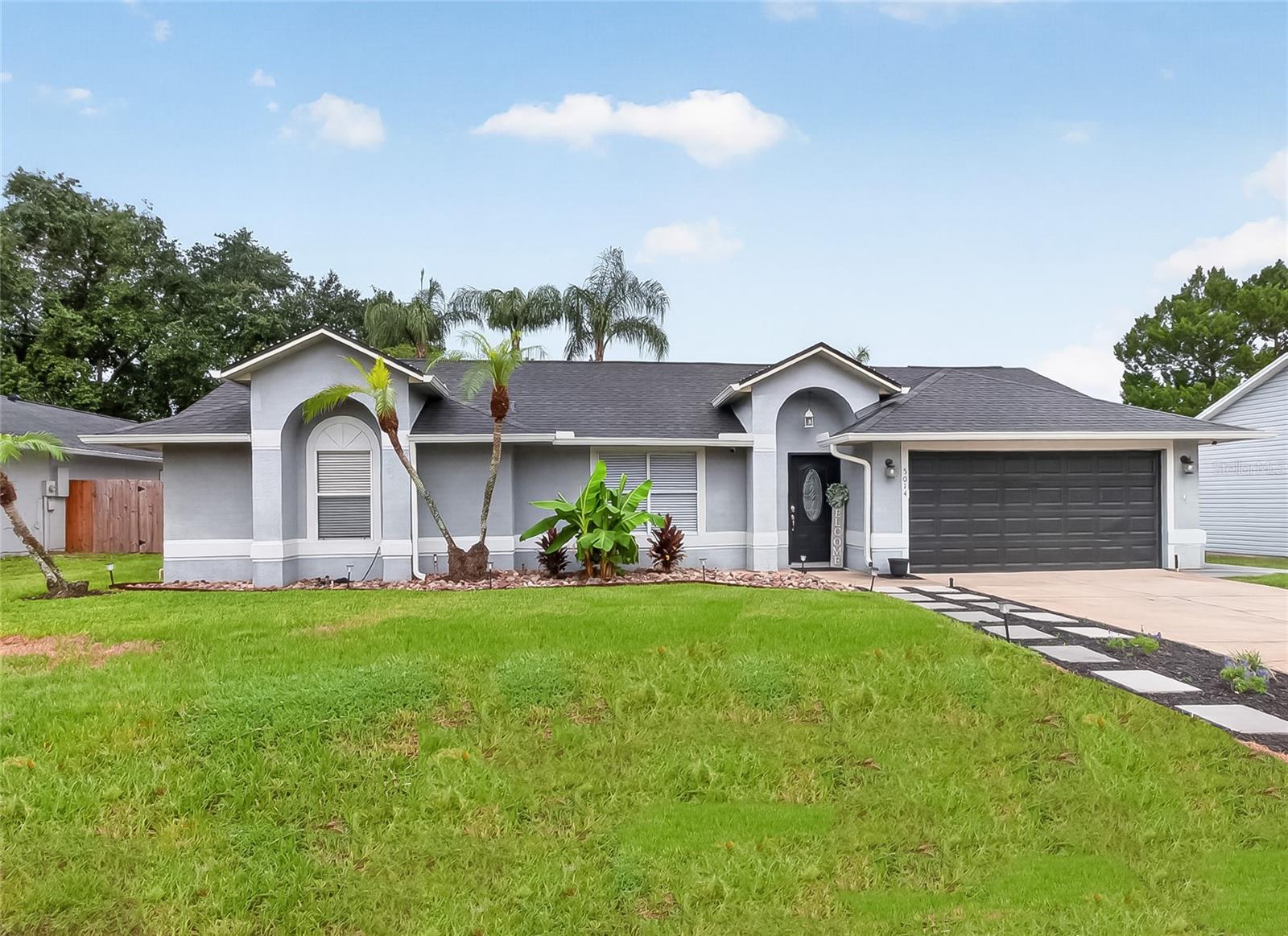 Under contract-accepting backup offers. Welcome home to this beautifully updated residence featuring an open floor plan designed for comfortable living and effortless entertaining. Located in a well-established neighborhood, this home offers numerous recent upgrades, including a new roof (2022), new A/C (2024), a remodeled kitchen (2022), fresh interior paint, and tile flooring throughout—no carpet anywhere. Large windows throughout the home fill each space with abundant natural light, creating a bright and welcoming atmosphere. The spacious living room flows seamlessly into the dining area and remodeled kitchen, making it easy to stay connected whether you're entertaining guests or enjoying everyday life. The kitchen features elegant quartz countertops, ample workspace, and a window above the sink overlooking your backyard retreat. Step outside to your own private backyard oasis, where a sparkling screened pool and spa provide the perfect place to relax or entertain year-round. The spacious pool deck, outdoor kitchen, and oversized backyard offer endless opportunities for cookouts, pool parties, or simply enjoying a peaceful Florida evening. The thoughtfully designed split-bedroom floor plan provides added privacy for the owner's suite. This inviting retreat features beautiful wood-look tile flooring, a spacious walk-in closet with custom built-in shelving, and a beautifully renovated ensuite bath complete with a tiled walk-in shower and a relaxing garden tub. On the opposite side of the home, you'll find two generously sized guest bedrooms with wood-look laminate flooring and a well-appointed guest bath featuring granite countertops and coordinating wood-look tile flooring. With modern updates, an open and airy layout, abundant natural light, and exceptional indoor-outdoor living, this move-in-ready home is ready for you to enjoy.
