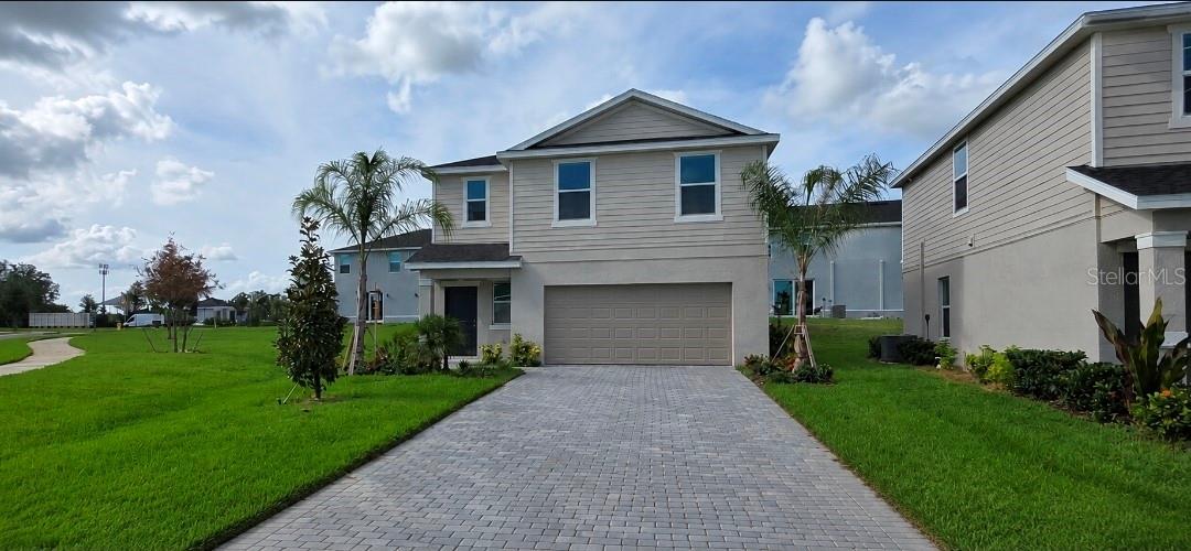 Welcome to Aurora at Lakewood Ranch, where contemporary design meets maintenance-free Florida living. This beautifully designed Atlanta floor plan offers an open-concept layout with 3 bedrooms, 2.5 bathrooms, and a spacious 2-car garage, providing the perfect combination of comfort, functionality, and style.  The first floor features a bright and inviting living space that seamlessly connects the kitchen, dining area, and great room, creating an ideal setting for entertaining and everyday living. The chef-inspired kitchen showcases quartz countertops, stainless steel appliances, designer cabinetry, and a large center island overlooking the main living area. Sliding glass doors provide access to the outdoor patio, offering the perfect space to enjoy Florida's year-round sunshine.  Upstairs, the spacious owner's suite serves as a private retreat with a large walk-in closet and an en-suite bathroom featuring dual vanities and a walk-in shower. Two additional bedrooms, a full bathroom, and a conveniently located laundry room complete the second floor, providing flexibility for family, guests, or a home office.
Built with modern finishes throughout, this home includes quartz countertops, smart home technology, energy-efficient features, hurricane protection, and thoughtfully selected designer details. The attached 2-car garage offers ample storage and convenience.
Residents of Aurora enjoy a maintenance-free lifestyle with lawn care included, along with community amenities such as a resort-style pool, playground, and scenic lake. Located within the award-winning Lakewood Ranch master-planned community, Aurora offers easy access to shopping, dining, top-rated schools, medical facilities, entertainment, and the world-famous Gulf Coast beaches.
Move-in ready and perfectly positioned in one of Southwest Florida's most desirable communities, this home is an exceptional opportunity to enjoy the Lakewood Ranch lifestyle.
