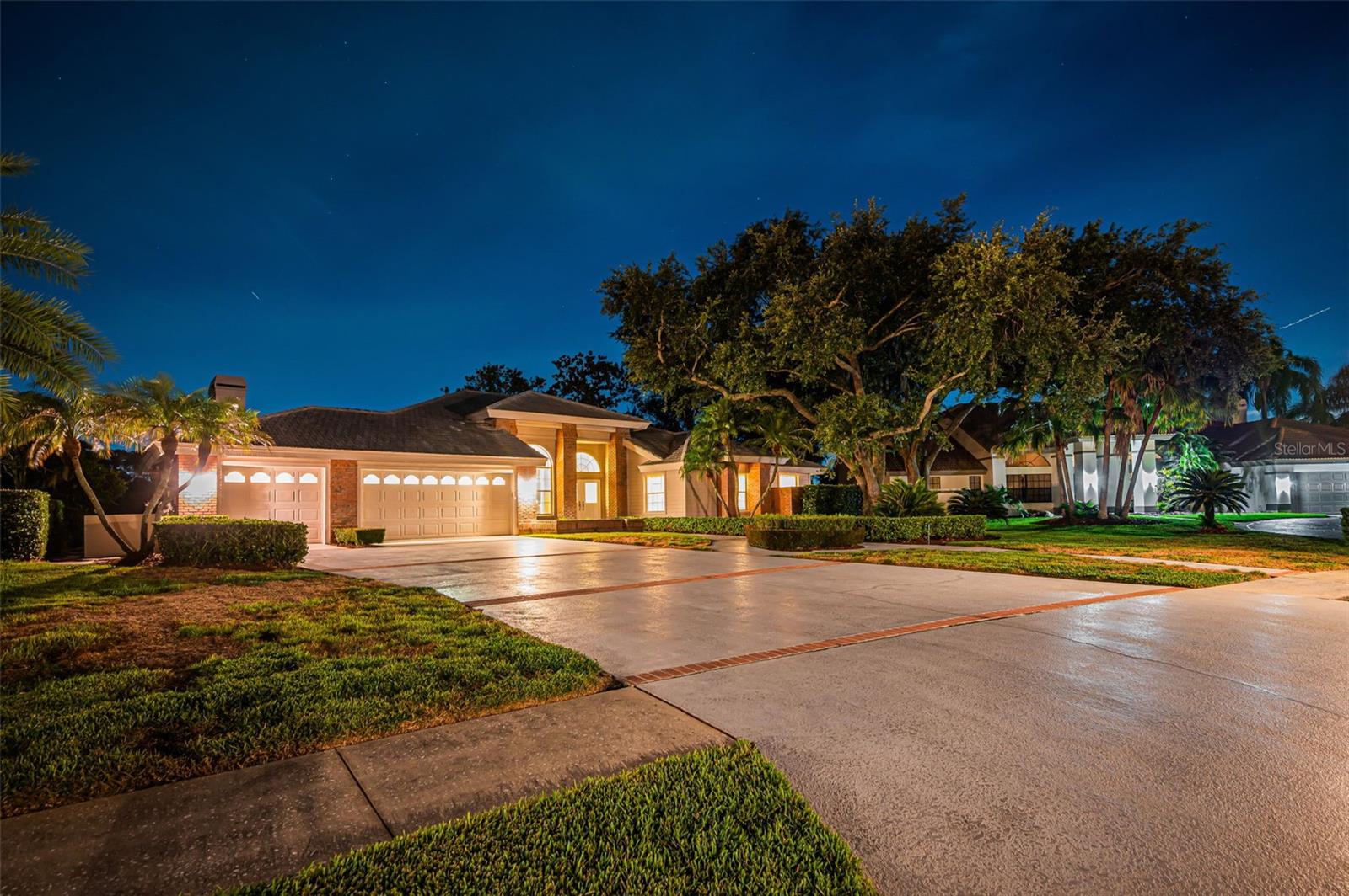 Virtually Staged. Absolutely stunning describes this home’s pristine golf course and water views with a magnificent lot perfectly positioned and affording much sought-after privacy from neighboring homes – creating a serene backdrop for relaxation and elegant entertaining. Nestled in the beautiful Aberdeen subdivision, this residence is located within the desirable gated golf community of East Lake Woodlands. Longing for a golf course lot but worried about fencing? A very special feature is the masonry wall enclosure located on the side of the home and measuring 50 feet long and 3 feet high - perfect for pets, a garden, play area or other possibilities to fit your individual needs. Stepping inside you are greeted with soaring volume ceilings, expansive living spaces, neutral tones throughout and transom windows and glass sliders inviting natural light while seamlessly connecting the interiors to the resort-style outdoor setting. A showcase gas fireplace anchors the family room complete with wet bar, adding sophistication and warmth, while the thoughtfully designed split floor plan offers exceptional privacy for owners and guests alike with 3 bedrooms plus an office/den that can be converted to a 4th bedroom. The kitchen blends style and function with stainless steel appliances, granite countertops, abundant cabinetry, a breakfast bar and ample eat-in area where golf course panorama can be enjoyed daily. Retreat to the primary suite with serene views and spacious bathroom with dual vanities, soaking tub, walk-in shower and 2 sizable closets. The expansive outdoor retreat is designed to impress, featuring a large sparkling pool and spa, generous covered lounging and dining areas and a well-appointed outdoor kitchen with gas grill. This lot is located in the preferred Zone X which does not require flood insurance and the owners had no issues during the 2024 hurricanes. Additional peace of mind comes with two Trane A/C units replaced in 2025, including 5-ton and 2-ton units. Offering an enviable combination of privacy, luxury, indoor-outdoor living, and picturesque views, this East Lake Woodlands residence presents a rare opportunity to enjoy an elevated lifestyle in one of the area’s most desirable gated golf communities. Optional memberships are available for a wide array of amenities with Ardea Country Club including 2 golf courses, tennis and pickle ball, fitness center, heated lap and free form pools, dining and social events. All this in a premier location convenient to Tampa International Airport, medical facilities, A-rated schools, award-winning beaches as well as professional sporting events, concerts, fine dining and more in the Tampa Bay area. Premier privacy and stunning views are hard to come by - you can enjoy waking up to this incredible scenery and make this home truly your own at this exceptional price.
