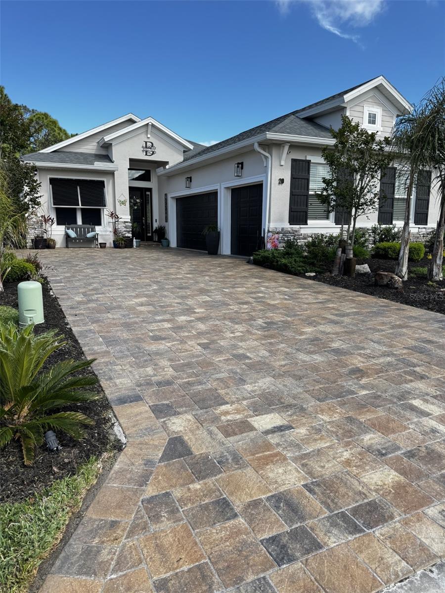 Welcome to 20 Spring Street Palm Coast, FL 32164 - Coastal Gardens Community- Town Center

Exclusive home in desirable Town Center Coastal Gardens Palm Coast - Premium preserve homesite Luxury Custom block courtyard home with a Custom Resort-Style private In-ground pool with Premium Upgrades. Why wait to build when this immaculate, fully upgraded custom built home is ready for you to enjoy today! Home is 3 years and 8 months young - Offering the Canterbury Model 3 bedrooms, 3 full bathrooms and a flex room with a sun tunnel. Total 2,692 total sq. ft. of beautifully designed living space, this exceptional residence combines luxury, comfort, and effortless Florida living.

***Many high-end furnishings are included making this home an exceptional turnkey opportunity.***

Step inside and immediately appreciate the soaring 10–13 ft. ceilings, elegant 8-ft. doors throughout, and refined finishes throughout, creating a light, open and sophisticated atmosphere and great for entertaining.
The chef’s kitchen is the heart of the home, featuring a spectacular 12-foot center island, high-end appliances, and abundant space for cooking, gathering, and entertaining.

Step outside to your private resort-style oasis. The expansive 40' x 14' screened lanai showcases a stunning saltwater in-ground pool with a travertine edge, waterfall feature, sun shelf with umbrella stand and evening lighting, creating the perfect setting for relaxing nights or lively gatherings. The fully equipped summer kitchen with a Blaze stainless steel gas grill and sink makes outdoor entertaining effortless while you enjoy Florida’s sunshine and breezes.

Situated on a premium lot backing to a protected preserve and a view of the pond, The backyard offers full privacy with no neighbors behind you. Comparable homes in the same price range simply can’t offer all that this home has to offer. Truly a must see!

This meticulously maintained home also includes:

* CDD bond fully paid, saving thousands! Only pay the maintenance portion of $262.00 year which is included in the property taxes which is $6,164 yr.
* Whole-house Brita Pro water filtration system for exceptional water quality throughout the home.
* Exclusive Courtyard home with a 3-car garage with durable XANO521 coated flooring.
* Rare “Florida Basement” attic tons of storage with pull-down stairs, flooring, and lighting
* Professionally designed landscaping and lighting
* Sealed brick paver driveway
* Transferrable structural warranty
* Bahama / Plantation shutters
* Full Gutters
* Fully fenced yard with 3 access gates
* Low HOA dues $650.00 per year only $54.00 month.
* Fast closing available

Located just minutes from Flagler Beach, with nearby walking and biking trails, this home delivers the perfect blend of luxury living, privacy, and convenience.