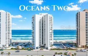 Experience resort-style oceanfront living at the iconic Oceans Two Condominium, Daytona Beach Shores' flagship oceanfront residence, celebrated for its superior construction and timeless design. Unit 705 offers an unparalleled coastal lifestyle with sweeping Atlantic Ocean and Halifax River views that can be enjoyed from nearly every room.. This beautifully updated 2-bedroom, 2-bath residence features the highly sought-after Flying Wedge floor plan, offering two private primary suites in a desirable split-bedroom layout. The building's distinctive architecture, highlighted by its dramatic 30-foot balcony overhang, frames spectacular coastal vistas while providing the perfect balance of natural light and shade, creating a living experience unlike any other on the beach. Designed with coastal elegance and comfort in mind, the open-concept floor plan is flooded with natural light through expansive picture windows and sliding glass doors that showcase panoramic ocean views. Luxury vinyl flooring, electric shades, and a neutral coastal palette create a sophisticated yet relaxed atmosphere. The spacious living and dining areas flow seamlessly onto the private balcony, providing the ideal setting for morning coffee, dolphin watching, or evening sunsets over the river. The updated kitchen has been thoughtfully redesigned to open to the main living space, creating a more inviting layout for entertaining and everyday living. Coastal-inspired cabinetry, tile backsplash, updated countertops, breakfast bar seating, and modern appliances combine style and functionality. Tile flooring extends through the kitchen and welcoming entry foyer. Wake each morning to stunning ocean views from the spacious primary suite, featuring generous closet space and an ensuite bath with a tub/shower combination, vanity, and multiple storage closets. The second primary suite offers privacy for guests and includes a large walk-in closet and access to an updated bath featuring a tiled walk-in shower. Abundant storage throughout the condominium is a rare and valuable feature. Residents of Oceans Two enjoy an exceptional resort-style lifestyle with private beach access, an oceanfront swimming pool, expansive paver sundeck, outdoor grilling area, beautifully renovated lobby, on-site management, fitness center, and two club rooms for social gatherings and activities. Daytona Beach Shores residents also enjoy access to the nearby community center featuring tennis courts, pickleball, golf opportunities, fitness programs, and year-round community events. Conveniently located near waterfront restaurants, shopping, marinas, golf courses, entertainment, and all that the Daytona Beach area has to offer, this move-in-ready oceanfront condominium delivers the perfect blend of luxury, convenience, and coastal living. Experience the resort lifestyle you've been dreaming of at Oceans Two. All information recorded in the MLS is intended to be accurate but cannot be guaranteed.