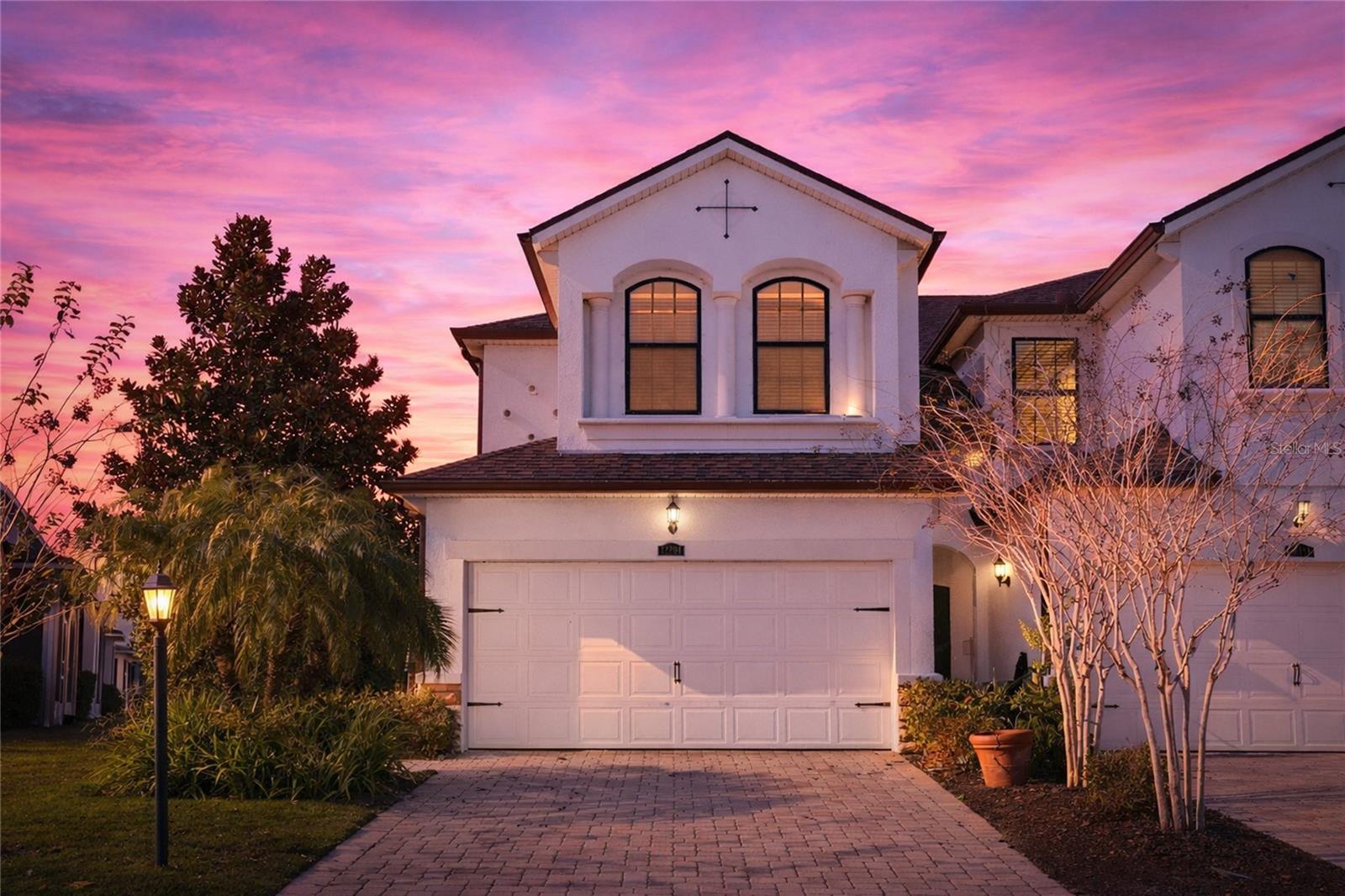 One or more photo(s) has been virtually staged. Welcome to your dream home or investment opportunity! Nestled in the amenity rich community of Harmony at Lakewood Ranch, this 3 bedroom end-unit townhome offers a spacious layout and prime location. As an end unit, this home enjoys added privacy and extra windows, while the peaceful pond view provides a relaxing backdrop for everyday living and entertaining. A full 2 car attached garage offers plenty of storage and convenience and a new roof in 2025 provides peace of mind. Step inside to discover a bright, updated home with lots of features. No need to clean or replace carpet as the 1st floor has tile throughout and the 2nd floor was updated with luxury vinyl plank (LVP) offering both modern appeal and durability. New paint throughout the home makes this a move-in ready home. Stretch out in the large open living room with lots of light and tranquil water views. The large kitchen is a chef's delight equipped with Caledonia granite countertops, ample Tahoe Espresso cabinets, custom tiled backsplash, and stainless steel appliances. Relax in the private screened lanai while enjoying the Florida wildlife in front of a serene water view. Upstairs you'll find a split bedroom floor plan which provides lots of privacy. The spacious owner's suite complete with tray ceilings and a large walk-in custom closet overlooks the peaceful pond below. The owner's ensuite bathroom features a double vanity and walk-in shower. Two other spacious bedrooms, one with an ensuite bathroom, and a laundry room conveniently located on the 2nd floor complete the upstairs.  Designer light fixtures and ceiling fans throughout the home create the finishing touches that make this home stand out. Situated just half a block away from the clubhouse, heated resort style pool, amenities, and private walking trails, the location of this home can't be beat. Enjoy maintenance free living with low fees and high class amenities, including a large fitness center, oversized playground and park, and a spacious community patio to socialize with friends and neighbors. An amazing location that is just minutes to A-rated schools including LECOM, fine dining, and lots of world class shopping. Lakewood Ranch offers the convenience of being centrally located to both Anna Maria Island and Siesta Key with each of their award-winning beaches!