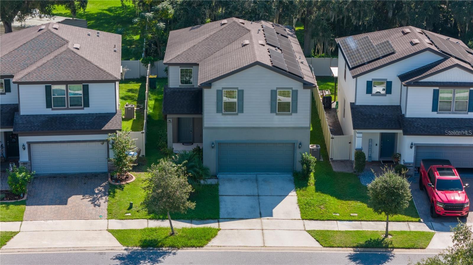 Enjoy beautiful open views with a community park and pool directly across the street! This well-maintained home features a fenced backyard and a screened lanai, perfect for relaxing or entertaining outdoors.

The first floor offers tile flooring throughout, an open-concept layout, granite countertops, and stainless steel appliances. The private owner's suite includes a spacious walk-in closet, dual vanities, and a walk-in shower.

A versatile flex room on the main level can be used as a home office, media room, playroom, or easily serve as a guest bedroom. Conveniently located near SR 417, Lake Nona VA Medical Center, Orlando International Airport, shopping, dining, and more.

The home is equipped with solar panels, offering the potential for lower electricity costs. Schedule your private showing today!
