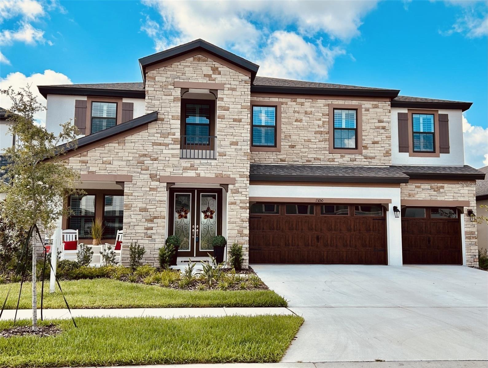 Discover this exceptional, nearly new residence offering 3,606 square feet of refined living space, featuring 5 bedrooms, a private den/office, an expansive bonus room, and 4 full bathrooms. Designed with elegance and functionality in mind, the expansive open-concept floor plan showcases Kinsdale Maple Slate cabinetry, Frost White MSI quartz countertops, and Prominence Plus Executive Oak luxury vinyl plank flooring throughout the main living areas. Seamless indoor-outdoor living is achieved through an oversized screened lanai, effortlessly connecting the great room, gourmet kitchen, and bright breakfast area—ideal for entertaining or everyday enjoyment. The first floor includes a dedicated den or office, perfect for remote work, along with a private guest suite and bath, offering comfort and privacy for visitors. Upstairs, you’ll find generously sized secondary bedrooms with walk-in closets, a large bonus room, a conveniently located laundry room, and a luxurious owner’s retreat featuring an oversized walk-in closet and a spacious, spa-inspired bathroom. Located within the master-planned Hawkstone community, residents enjoy resort-style amenities while remaining close to top-rated Lithia schools, scenic nature preserves, family-friendly attractions, and convenient access to US-301 and I-75. Outdoor enthusiasts will appreciate the pet-friendly hiking trails of the 969-acre Triple Creek Nature Preserve, just under two miles away, as well as Triple Creek BMX, located only one mile south of Hawkstone.