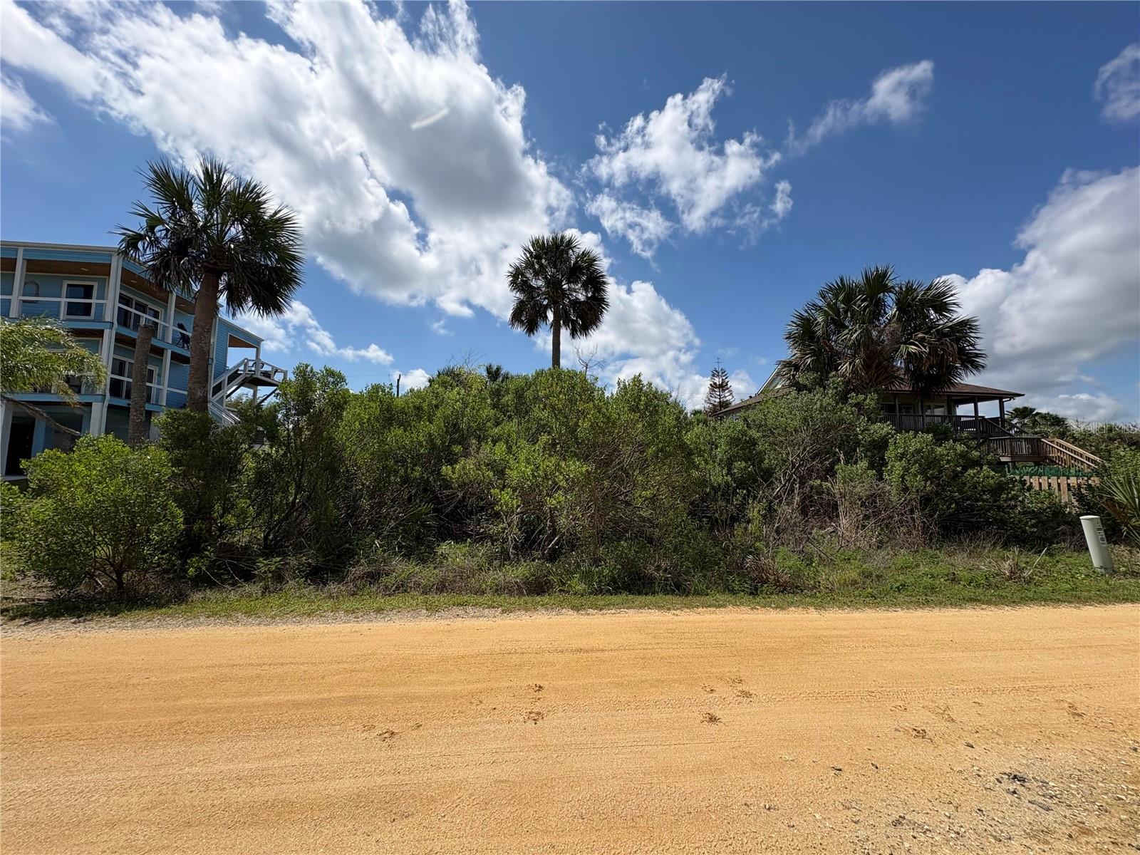 Vacant lot within a 2 minute flip flop stroll to the beach.  Build your dream home here and enjoy a secluded beach with resident access while viewing the beautiful State Park directly out of your front door.