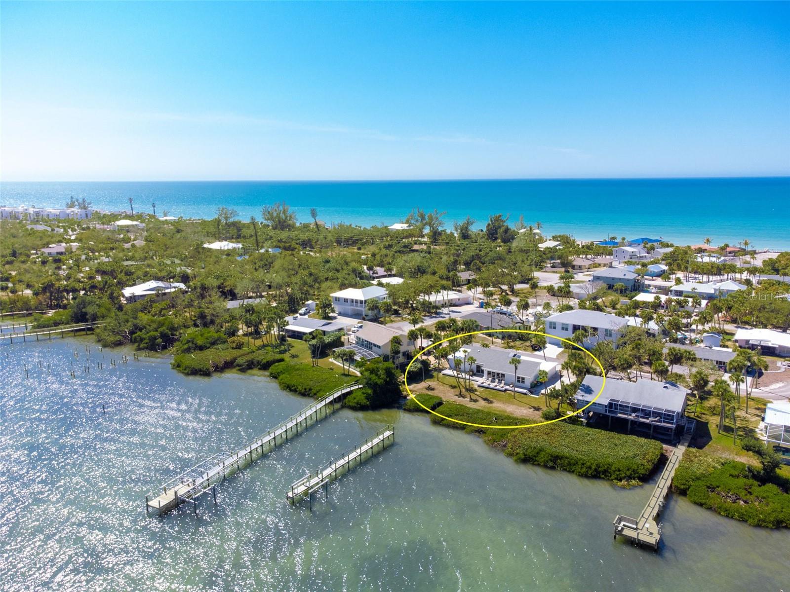 Experience the pinnacle of coastal luxury at 4087 Pelican Shores Circle, a masterpiece of modern design where every detail has been reimagined for the sophisticated buyer. This residence has undergone a complete, top-to-bottom HIGH-END RENOVATION by well know BAYFRONT BUILDERS, offering total peace of mind with a BRAND-NEW ROOF, new HVAC system, new electrical, new plumbing, and ALL-NEW IMPACT WINDOWS AND DOORS. Whether you are looking for a permanent family home, a vacation retreat, or a premier hosting venue, the layout is designed for effortless connection. The interior impresses with high ceilings, a mix of elegant decorative lighting and recessed lighting throughout, and luxury plank tile flooring that flows seamlessly through the open-concept living spaces.
The heart of the home is a chef’s dream, featuring QUARTZ COUNTERTOPS, custom soft-close wood cabinetry, and premium stainless steel appliances. The bathrooms are true sanctuaries, showcasing gorgeous high-end tile work and spa-like finishes. For those seeking flexibility, the floor plan features separate secondary suite-like area with its own walk-in closet and a private entrance through the garage, making it the perfect "home within a home" for multi-generational living or hosting long-term guests.
Outdoor living is redefined by a massive new composite deck that spans the entire rear of the property, putting you directly on the bay. Another huge perk is that there is plenty of room for your own custom pool! While you enjoy the community dock, the seller has already applied for private dock permit and obtained professional quote, paving the way for your own private slip. Beyond the bay, you also enjoy the best of the Gulf with DEEDED BEACH ACCESS AND ADDITIONAL BAY ACCESS WITH A COMMUNITY DOCK just moments away. From the impact-rated security to the turnkey luxury finishes, this home offers a rare opportunity to own a fully renovated waterfront sanctuary on where no expense has been spared. Living here means embracing a lifestyle where the hardest decision of your day is whether to watch the sunrise over the bay or the sunset over the Gulf. Manasota Key is a sanctuary of natural beauty, offering miles of uncrowded, pristine beaches famous for world-class shelling and prehistoric shark teeth. Spend your mornings exploring the winding canopy roads or kayaking through the mangroves of Stump Pass Beach State Park.
When evening falls, enjoy the island's vibrant social scene—just a short bike or golf cart ride away. From live music and waterfront dining at local staples like Lock ‘N Key or Sandbar Tiki & Grille to the charming shops and weekly farmer's markets on historic Dearborn Street just across the bridge, the Key offers a perfect blend of secluded tranquility and coastal convenience. Whether you are a boater, a beachcomber, or an epicurean, Manasota Key provides a lifestyle of unparalleled freedom and relaxation. Schedule your exclusive showing today and start living your best Florida Life!