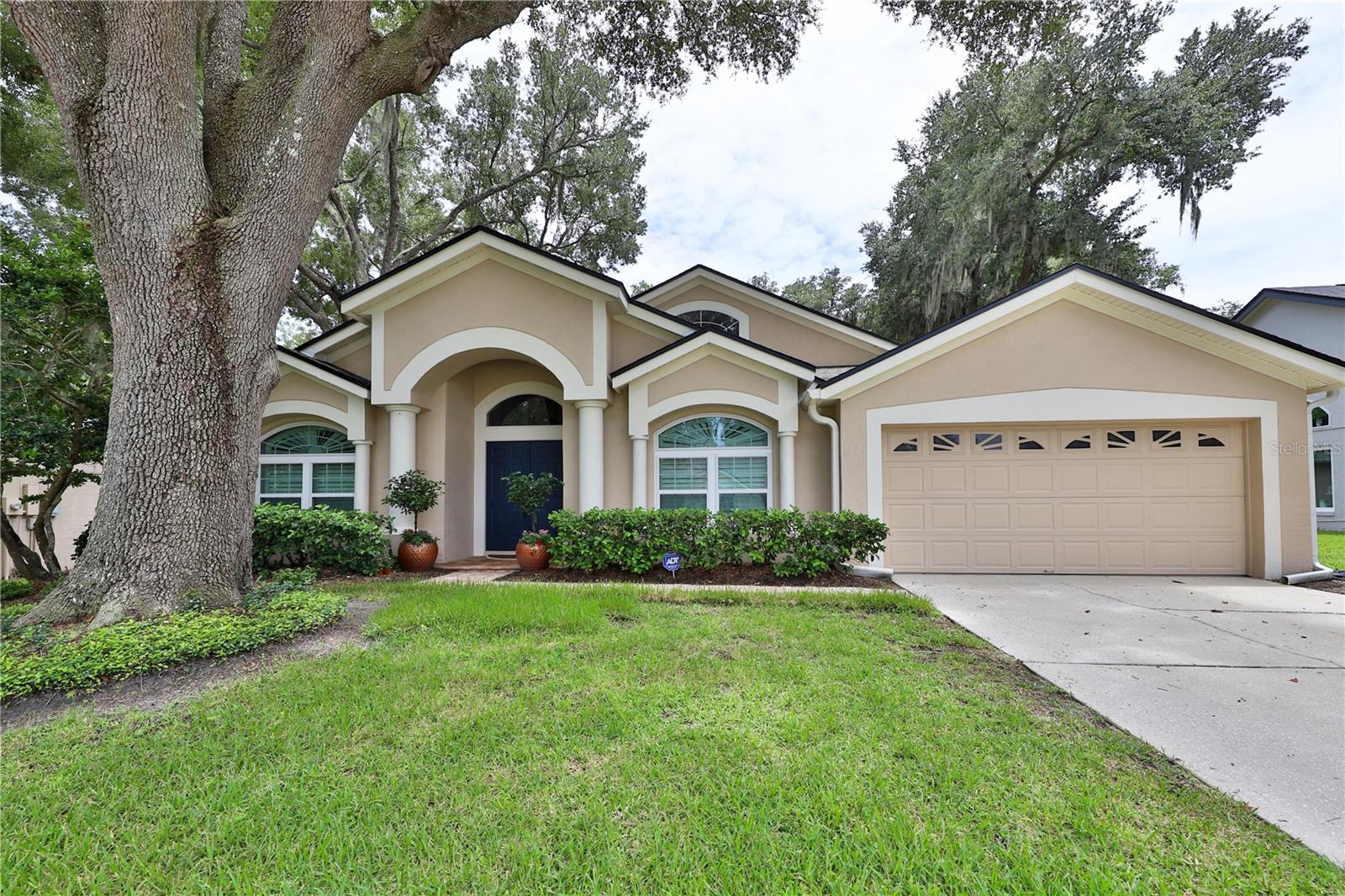 Outstanding renovations throughout this 4 bedroom, 3 bath.  $100,000 Kitchen remodel featuring modern cabinetry, high-end hard-stone countertops, top-of-the-line stainless steel appliances, and all-new electrical wiring. All bathrooms have been remodeled, including marble tile in the Master suite. Home features a full re-pipe, double-pane windows throughout with upgraded shutters, hardwood floors with carpet in select bedroom areas, custom hardwood closet organizers, high ceilings, and fresh paint with new door hardware and updated fixtures. Laundry room remodeled with barn door and automatic light sensor. Major mechanical updates include a A/C (2–3 years New), new AC compressor (2024), Roof replaced (2021) with upgraded shingles, new pool pump (2024), and pavers around the pool. Additional highlights include vaulted ceilings, golf-front backyard with beautiful views, and a split floor plan.  Open Concept single story  with a lot of natural Light. Move-in ready — hurry, it won’t last!