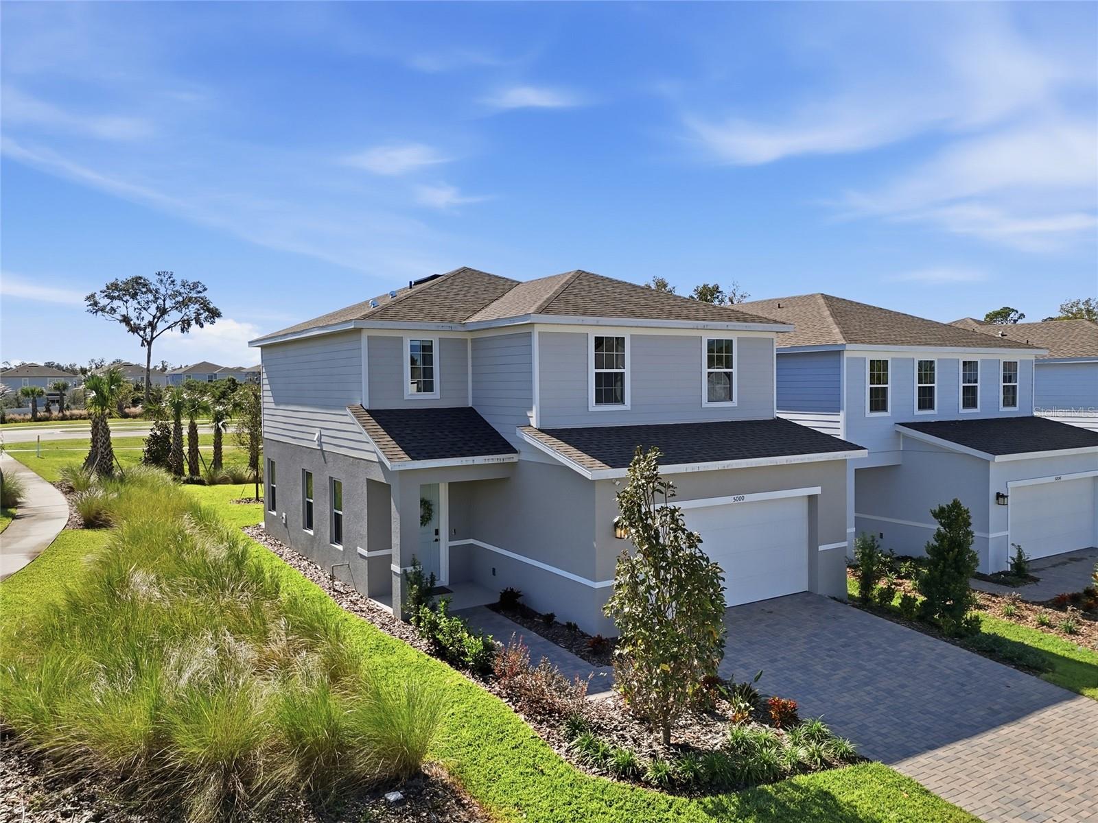 2025 BUILD | PREMIUM CORNER LOT | NO REAR NEIGHBORS! Skip the build wait at 5000 Bear Lake Loop in DeLand’s Lakewood Park! This move-in ready 3 bed, 2.5 bath home + large upstairs flex loft (easy 4th bedroom conversion!) sits on a great corner lot offering sun-drenched views, and refined finishes throughout the place. The Gourmet chef’s kitchen boasts quartz countertops, cooktop, double wall ovens, GE stainless steel appliances, and soft-close cabinets. Upgrades include Luxury Vinyl Plank (LVP) flooring, smart home tech package, irrigation system, and a 10-Year Structural Warranty. Primary suite features a custom shower enclosure. Resort Amenities & Location: Enjoy low maintenance living with a community pool and low HOA ($262/quarter)—CDD is conveniently included in property taxes. Minutes to award-winning Historic Downtown DeLand, Stetson University, Blue Spring State Park, and a quick drive to New Smyrna Beach. It's your move-in ready luxury home and this if your sign to tour today!