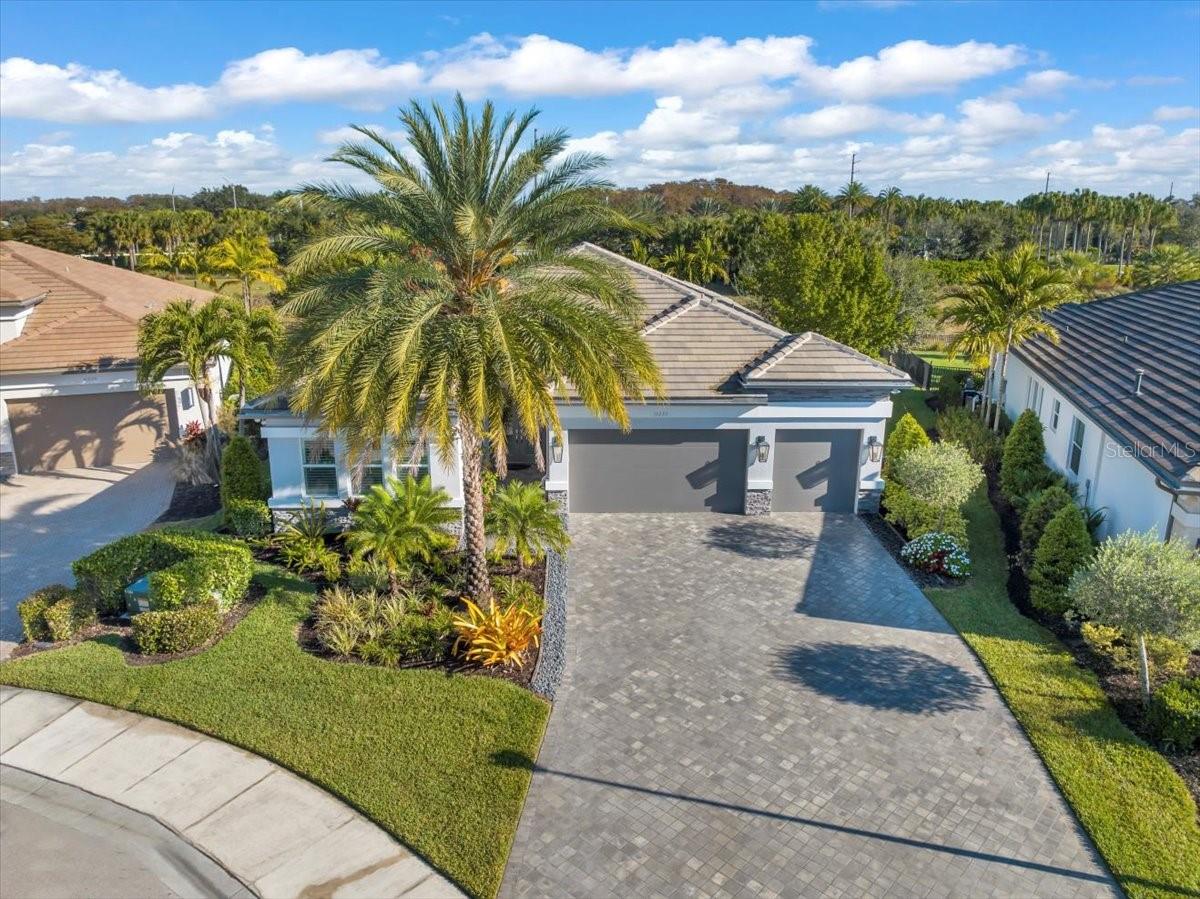 Seller is highly motivated and prepared for a smooth, quick closing opportunity—creating an exceptional chance to secure one of the most upgraded luxury homes available in Valencia Trails at an incredible value.
Luxury living reaches a new level in one of Naples’ premier resort-style active adult communities. Perfectly positioned on a private cul-de-sac lot with lush tropical privacy, this professionally decorated former model-style residence showcases an extraordinary level of designer upgrades rarely found in the community.
This highly desirable split-bedroom floor plan offers 3 spacious en-suite bedrooms, a dedicated office/den, 3 full baths, and a powder bath, all thoughtfully designed for both elegant entertaining and comfortable everyday living. From the moment you enter, you are welcomed by elevated designer finishes, tray ceilings with crown molding, plantation shutters throughout, custom built-ins, upgraded lighting, porcelain tile flooring, and luxurious details that create a true showcase home experience.
The gourmet chef’s kitchen flows seamlessly into the expansive living and dining areas, creating the perfect setting for entertaining guests or enjoying quiet luxury year-round.
The outdoor living space rivals a private resort, featuring a custom two-tier pool and spa, upgraded ambient lighting across the pool deck, sealed pavers, outdoor summer kitchen, professionally designed tropical landscaping, and a completely FENCED private backyard creating an unmatched sense of exclusivity and serenity.

This home has been extensively upgraded with premium features including:
• Whole-house natural gas generator
• Climate-controlled garage with split AC system
• Custom Swiss Trax garage flooring
• ProSlat wall storage system for exceptional organization
• Entire home, garage, and pool area wired for the premium Sonance sound system
• Plantation shutters throughout
• Designer lighting and professionally curated finishes throughout the home and so much more.
Every detail has already been completed for the next owner, allowing buyers to immediately enjoy the luxury lifestyle without the time, expense, or stress of upgrading a new build. This home offers exceptional value for both seasonal and full-time residents seeking one of the most upgraded and move-in-ready homes available in Valencia Trails today.

Residents enjoy world-class amenities including a luxury clubhouse, restaurant, resort-style pool, pickleball, tennis, bocce, fitness center, walking trails, dog park, and an active social calendar—all just minutes from Naples’ renowned beaches, upscale shopping, and fine dining.
