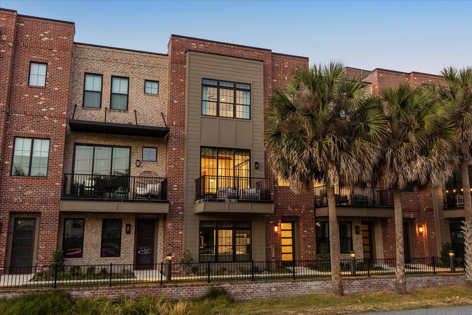 Experience the ultimate in luxury urban living at 68 N Park Ave, a stunning 3-story townhome with rooftop deck located in the heart of Historic Downtown Winter Garden. This sophisticated 4-bedroom, 4.5-bathroom residence offers over 3,500 sq. ft. of meticulously designed space, seamlessly blending modern elegance with the charm of the historic district. The open-concept main level features soaring 11-foot ceilings, expansive industrial-style windows, and a chef’s dream kitchen equipped with an oversized quartz island, natural gas appliances, and custom artisan cabinetry. Accessibility is effortless with your own private elevator serving all floors. Retreat to the third-floor master suite, featuring a spa-inspired bath and massive walk-in closet, or host guests in the versatile first-floor bedroom suite. The "wow factor" continues on the 1,200 sq. ft. private rooftop terrace, offering panoramic views of the city skyline—the perfect spot for evening cocktails or watching local fireworks.Location is everything. Leave your car in the 2-car garage and embrace the golf-cart-friendly lifestyle. You are just steps away from: The award-winning Winter Garden Farmers Market, The vibrant Plant Street Market and Crooked Can Brewing Co, The world-class West Orange Trail for biking and running, Boutique shopping, fine dining, and the historic Garden Theatre. Don’t miss this rare opportunity to own a piece of downtown luxury. Schedule your private showing today!