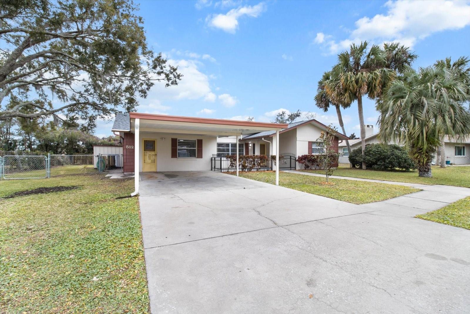 This beautifully remodeled home is right in the HEART of golf cart friendly Crystal River! This 3 bedroom, 2 bath home has been completely updated and is located a short walk or golf cart ride to all of your favorite downtown shops and restaurants. The kitchen features Cambria Luxury quartz countertops, beautiful cabinetry and new appliances. Beautiful wood plank tile throughout the entire home. All three bedrooms are oversized and both bathrooms feature new vanities. This home features plenty of room to entertain friends and family. Large living room offers views of the newly (2023) screened in 12x31 lanai and fenced backyard. Kitchen/Dining combo space will become a wonderful gathering spot to share a warm meal. New roof in 2023, new AC in 2017. Fenced in backyard features mango trees. Screened in lanai has double screened doors so you can conveniently store your golf cart. Shed conveys for extra storage. Located about a half a mile to world famous Three Sisters National Wildlife Refuge, you can watch the manatees play in the beautiful crystal blue water. Enjoy all that this waterfront community has to offer, kayaking, boating, fishing, and lots of walking and biking trails. So much to see and do in this Award Winning city!