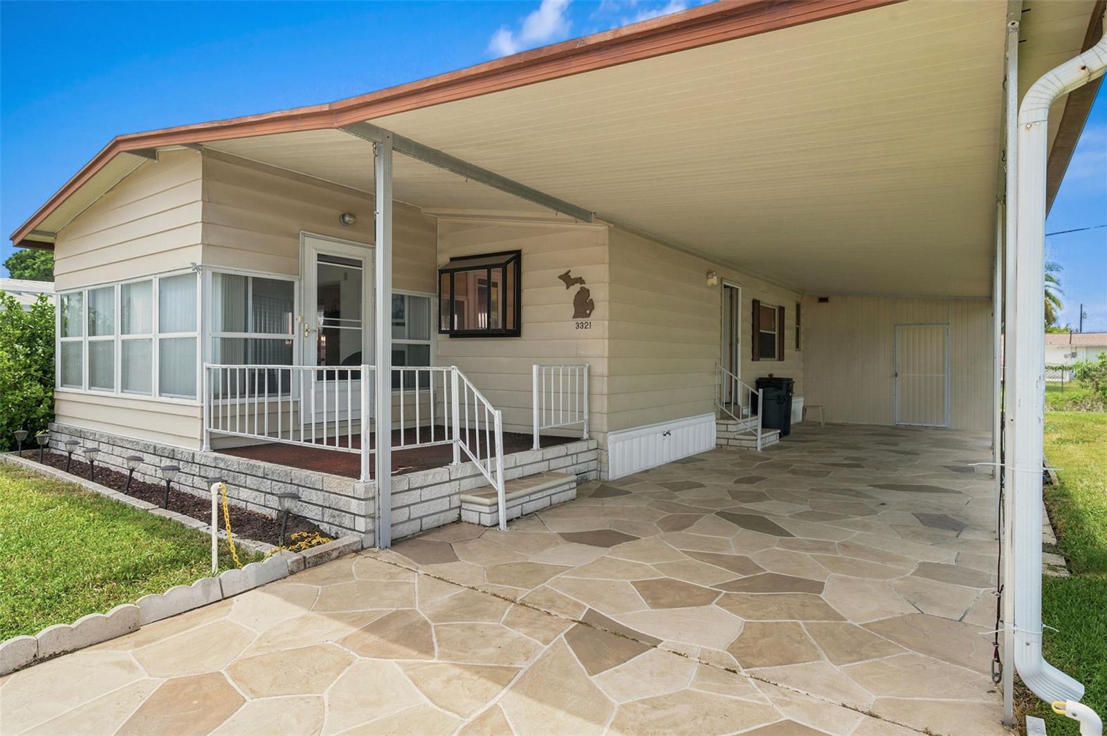 Welcome Home! This is a lovely 1152 sq ft Doublewide. It all ready for the new owners to enjoy! 2 Bed 2 Bath Split Plan offers all the comforts of Home! Relax in the peaceful finished porch/family room just off the living room. A kitchen with great space to cook and also a dining area to entertain! There is a 2 car carport and a utility shed with a Washer and Dryer.  The HVAC is August 2024! Roof 2013 all  for worry free Living! Non Flood Zone X500. This is a Friendly, Active Community, 55+, Heated Pool! Land Owned, AND Fully Furnished/Turnkey!! Schedule your appointment today!!