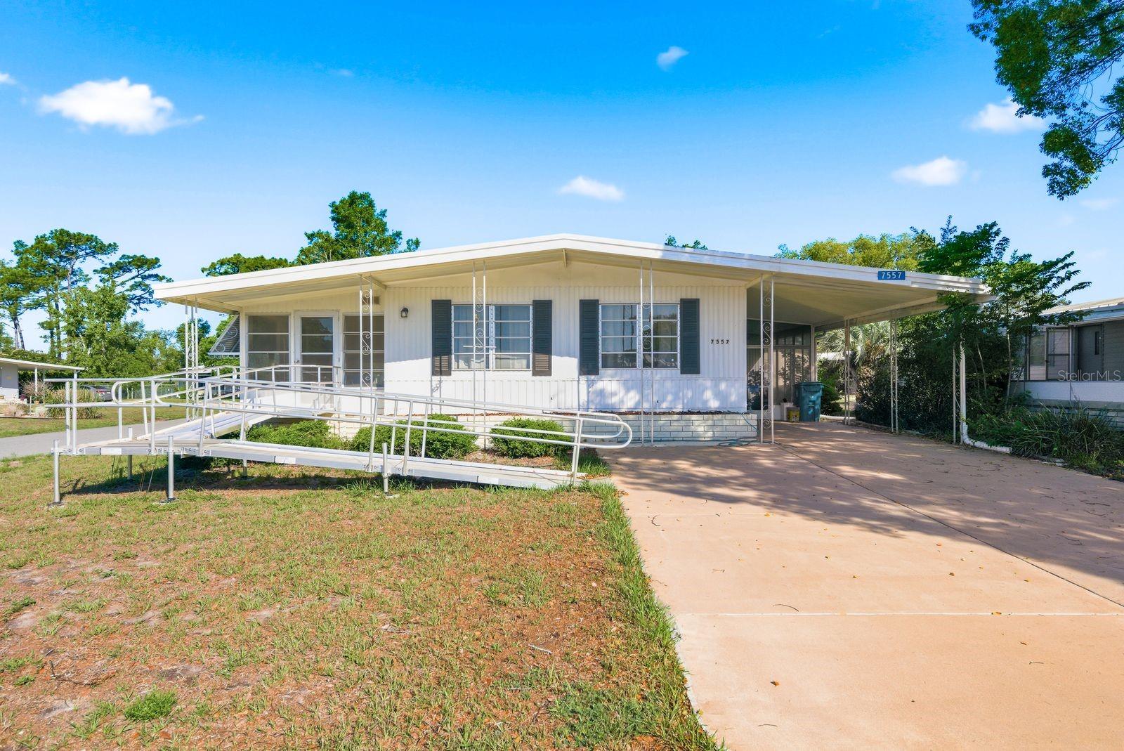 Welcome to the active 55+ community of High Point in Brooksville! This well-maintained 2-bedroom, 2 full bathroom home offers comfort, convenience, and an enjoyable Florida lifestyle. Inside, you’ll find newer luxury vinyl flooring throughout and concrete countertop in the guest bathroom. The home also features a wheelchair-accessible ramp for added accessibility.

Enjoy relaxing mornings or evenings in the screened porch, plus the convenience of a carport and additional garage storage space ideal for a golf cart. High Point residents enjoy access to an impressive lineup of amenities including an 18-hole golf course, community pool, pickleball, shuffleboard, bocce ball, horseshoes, cornhole, and monthly entertainment and social events at the clubhouse. Whether you’re looking for an active lifestyle or a peaceful place to call home, this property offers the best of both.