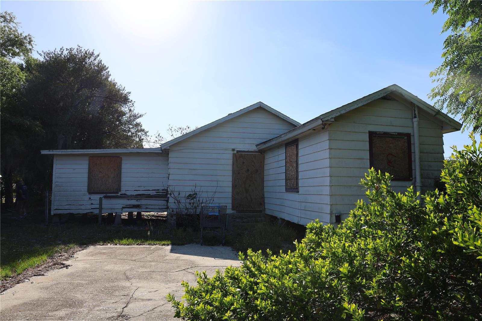 Opportunity knocks in the heart of Lake Wales! Located just minutes from downtown at 232 C Street, this .18-acre property sits within a designated redevelopment area, making it an ideal candidate for investors, builders, or those looking to start fresh.
The existing wood-frame structure is in need of a complete renovation, with all windows currently removed, offering a blank slate for your vision. Whether you choose to restore or rebuild, this property presents significant potential. Buyers may benefit from possible savings on impact fees. Conveniently positioned near downtown amenities, shopping, dining, and local attractions, this lot provides both location and opportunity. Bring your plans and imagination to transform this property into something new.
CASH ONLY-NO SIGHT UNSEEN OFFERS WILL BE REVIEWED