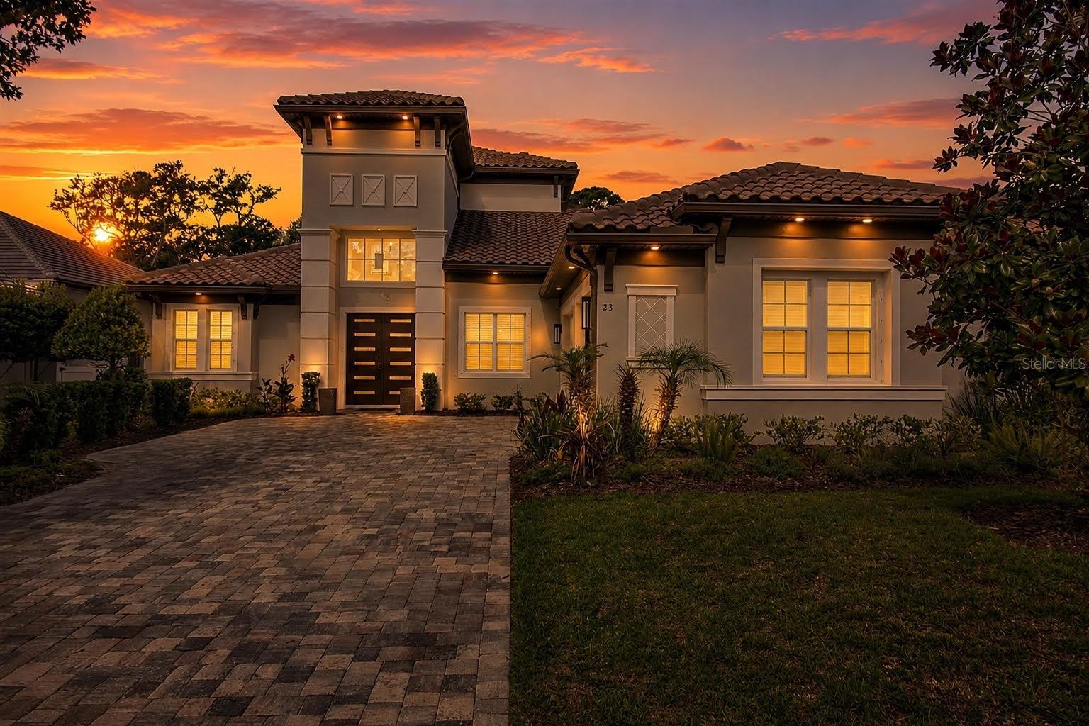 One-of-a-kind custom Gold Coast home, tucked within the private, gated community of Palm Coast Plantation. Long paver driveway, tile roof, and elegant double door entry set against refined architecture and landscaping welcome you home. Saltwater heated pool and spa connect to a smart phone-controlled waterfall feature, sitting beneath a panoramic lanai screen overlooking the lush Florida preserve. The expansive pavered pool deck and shaded covered area are complemented by a summer kitchen with sink, mini fridge, and counter seating. Soaring ceilings and tray ceilings pair beautifully with natural light pouring in through the sliding glass door and windows. The open-concept living room centers around a custom fireplace, flowing seamlessly into an elegant kitchen featuring a huge quartz island with storage and seating, solid wood cabinetry, high-end stainless steel appliances, built-in double ovens with air-frying capability, glass cooktop, vent hood, and walk-in pantry. All bedrooms are located on the first floor, each with its own private ensuite bathroom and built-in closet system. The luxurious primary suite offers his and her custom built-in closets, direct access to the outdoor lanai, and a spa-like ensuite with a walk-in tiled rain shower and separate sinks. Private office nestled near the foyer provides a quiet space to work, while a spacious laundry room off the garage entry adds everyday practicality. Oversized upstairs loft with doors offers added privacy, along with a half bathroom and an open balcony overlooking the beautiful preserve. Additional features include a 3-zone HVAC system and full hookup for a whole-house automatic generator.
Palm Coast Plantation offers 24-hour guarded gate security along with impressive amenities including a community pool, clubhouse, fitness center, pickleball courts, playground, and intracoastal fishing pier. All within minutes from Flagler Beach, local shopping and dining, and miles of highly rated walking/biking trails.