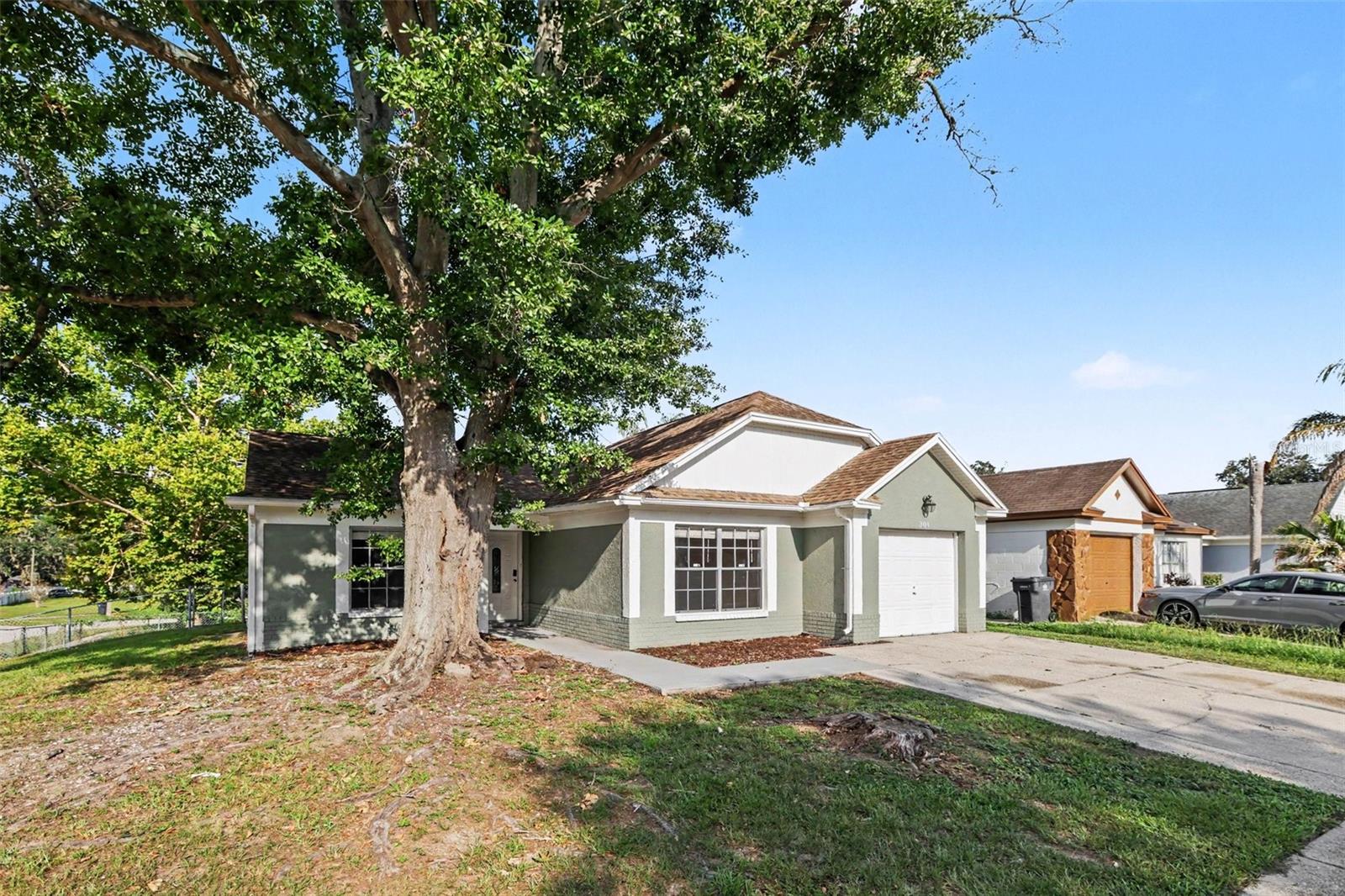 This exceptional 3-bedroom, 2-bathroom home is beautifully situated on a highly desirable corner lot, offering enhanced curb appeal, extra privacy, and premium neighborhood presence. The heart of the home features a beautifully updated kitchen fully outfitted with elegant granite countertops and a sleek suite of premium stainless steel appliances, creating a and highly durable hub for cooking and entertaining. Designed with a thoughtful division of space, the main living areas an inviting flow for daily activities, while the private quarters transition into quiet personal retreats where plush carpeting highlights all three bedrooms to maximize underfoot warmth, quietness, and insulation.