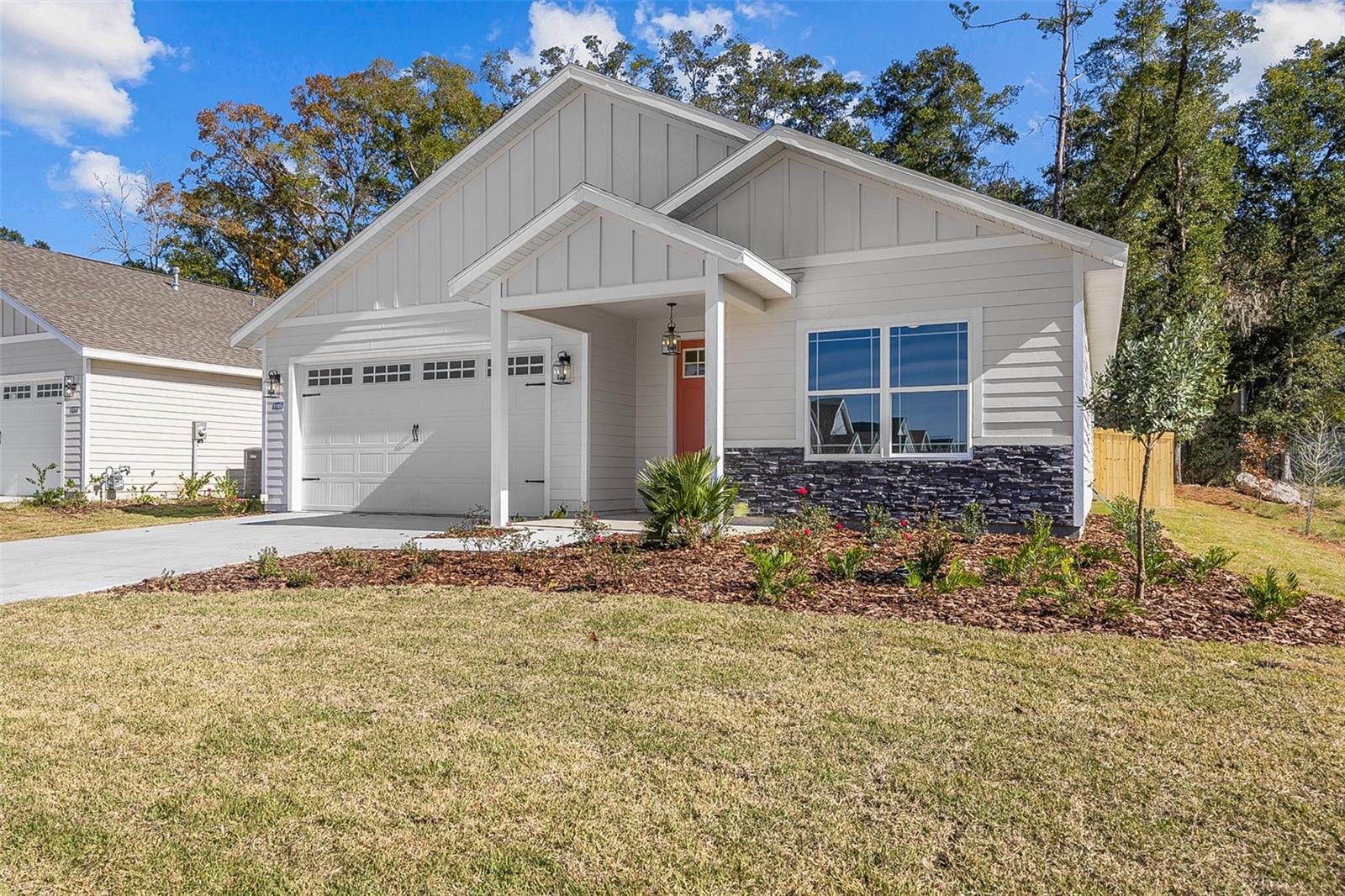 Under Construction. Ready for move-in December 2023. William Weseman built home. Conventional, VA, FHA and 100% financing options available. Optional builder upgrades shown in sample photos from previously completed homes. The Thomas Floor Plan on a premium corner Lot 207 in Grand Oaks. Grand Oaks is located along Tower Road near the Oak Hall School and Markets West commercial area featuring a new O2B Kids, HCA Medical Center, gas station, shopping and office space. Convenient access to the University of Florida, Shands Hospital, I-75 and Archer Road via the second entrance on SW 20th Avenue. The Thomas is an elegant, single level William Weseman home that optimizes living space with an open kitchen overlooking the living area, large dining area and outdoor covered lanai. The owner’s suite, located at the back of the home, has an en-suite bathroom with walk-in shower, linen closet, quartz counters and a luxurious walk-in closet. Two additional bedrooms share a full bathroom at the front of the home jack-and-jill style. The fourth bedroom with another full bathroom is located across from the laundry room. This beautiful 3-way split layout provides a lot of flexibility. 1900 SF. Hardie with joint covers, stacked stone accents and 30-year shingle roof. Wood Plank Porcelain Tile flooring throughout and ceramic tile in bathrooms, no carpeting.  Tray ceiling in living area and owner's suite. 9' ceilings, 8' entry door and rear glass sliders. Built to the latest specifications with energy-efficient features. Design selections, personalizations and upgrades available.