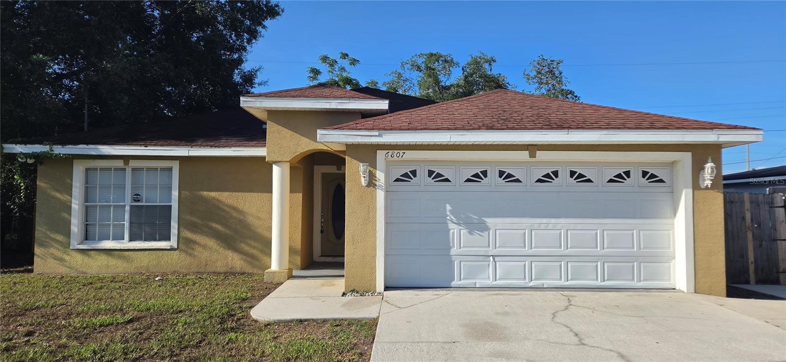 3-bedroom, 2-bath, 2-car garage block home with 1,770 square feet and a bonus room in East Tampa. Located in a NON-Flood Zone with no HOA, no deed restrictions, no pet restrictions, and no lease restrictions. Open floor plan connects the living, dining, and kitchen areas. Bonus room off the primary bedroom is ideal for a home office, nursery, gym, or flex space. Kitchen includes a glass-top range, French door refrigerator with ice and water dispenser, microwave, dishwasher, breakfast bar, pantry, and plenty of cabinet and counter space. Formal dining area is located just off the kitchen. Primary suite includes a private bathroom with a jetted tub, dual-sink vanity, and separate shower. Ceramic tile flooring throughout the main living areas with wood laminate flooring in the bedrooms. Ceiling fans and central heat and air provide year-round comfort. Fenced backyard features a lanai with room for grilling and entertaining. Attached 2-car garage provides parking and additional storage. Conveniently located minutes from Downtown Tampa, Seminole Hard Rock Hotel & Casino, Florida State Fairgrounds, I-4, I-75, and the Selmon Expressway with easy access to shopping, restaurants, schools, and major employers. Seller will consider owner financing, lease purchase, and assistance with buyer closing costs. Cash, Conventional, FHA, and VA financing welcome. MLS Search Keywords: Open floor plan, split bedroom floor plan, block home, bonus room, flex space, home office, fenced backyard, lanai, 2-car garage, ceramic tile, wood laminate flooring, breakfast bar, pantry, jetted tub, dual-sink vanity, East Tampa, Downtown Tampa, Seminole Hard Rock, Florida State Fairgrounds, I-4, I-75, Selmon Expressway, NON-Flood Zone, no HOA, no deed restrictions, no pet restrictions, no lease restrictions, owner financing, seller financing, lease purchase, closing cost assistance, FHA, VA, Conventional, first-time home buyer, investor, move-in ready.