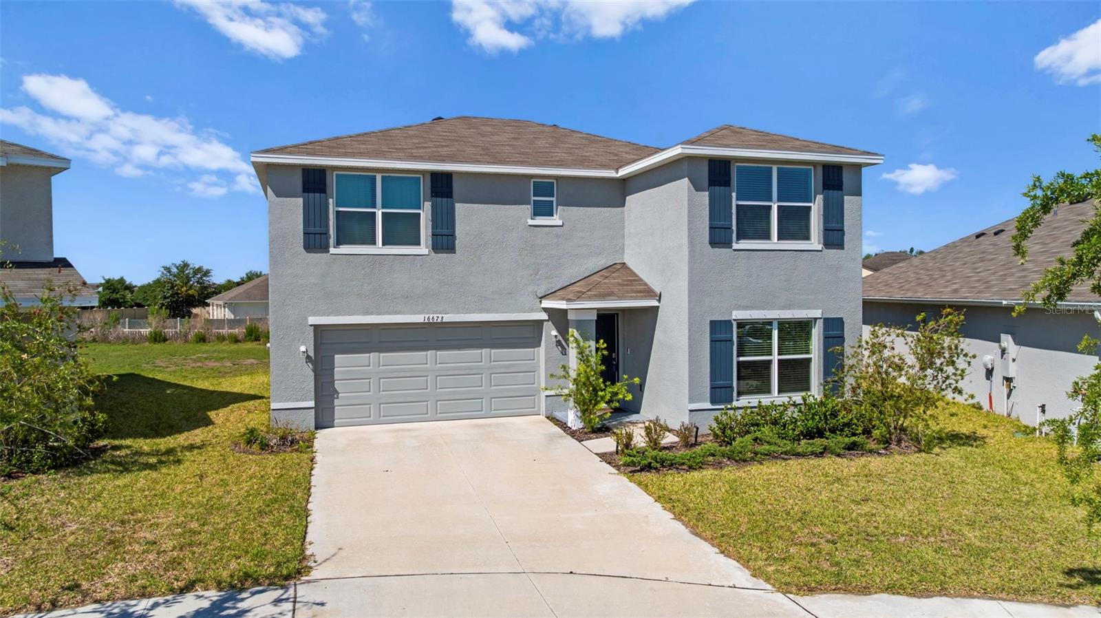 Skip the construction delays, builder upgrades, and uncertainty of new construction—16673 Windmill Forge Pass is ready right now.

Built in 2023 and located behind the gates of Sereno, this 4-bedroom, 3-bathroom home offers 2,435 square feet of living space with a layout that simply works. Since purchasing the home, the owners have thoughtfully enhanced the property with a water filtration and softener system, upgraded kitchen lighting, and a custom kitchen backsplash that adds both character and style beyond the original builder finishes.

The main level features an open-concept design where the kitchen overlooks the living and dining areas, making it easy to stay connected whether you're entertaining guests or keeping an eye on the family. A first-floor bedroom and full bathroom provide flexibility for visiting guests, a home office, or multi-generational living.

Upstairs, the loft creates a second living space that's increasingly hard to find in today's homes. Whether you need a media room, playroom, workout space, or simply a place for everyone to spread out, this area gives you options. The spacious primary suite serves as a private retreat, while the additional bedrooms offer plenty of room for family and guests.

What makes Sereno particularly appealing is the lifestyle. Residents enjoy a gated entrance, resort-style pool, clubhouse, playground, dog park, and walking trails, all while being conveniently located between Tampa and Sarasota. Even better, the HOA fee is just $90 per month and includes internet service and cable TV—an exceptional value compared to many newer communities. Shopping, dining, healthcare, and everyday conveniences are just minutes away, and with easy access to US-301 and I-75, commuting throughout the Tampa Bay area is surprisingly convenient.

The surrounding area continues to attract buyers looking for more space, newer homes, and a growing list of amenities. Nearby Parrish has become one of Florida's fastest-growing communities, offering a blend of small-town charm and modern conveniences. Residents enjoy easy access to shopping, restaurants, golf courses, waterfront destinations, and some of Florida's most desirable Gulf Coast destinations.

Unlike many newer homes where buyers still need to budget for upgrades after closing, many of the finishing touches have already been completed here. For buyers looking for the benefits of newer construction without the wait, this home offers a chance to move right in and start enjoying everything this growing area has to offer.