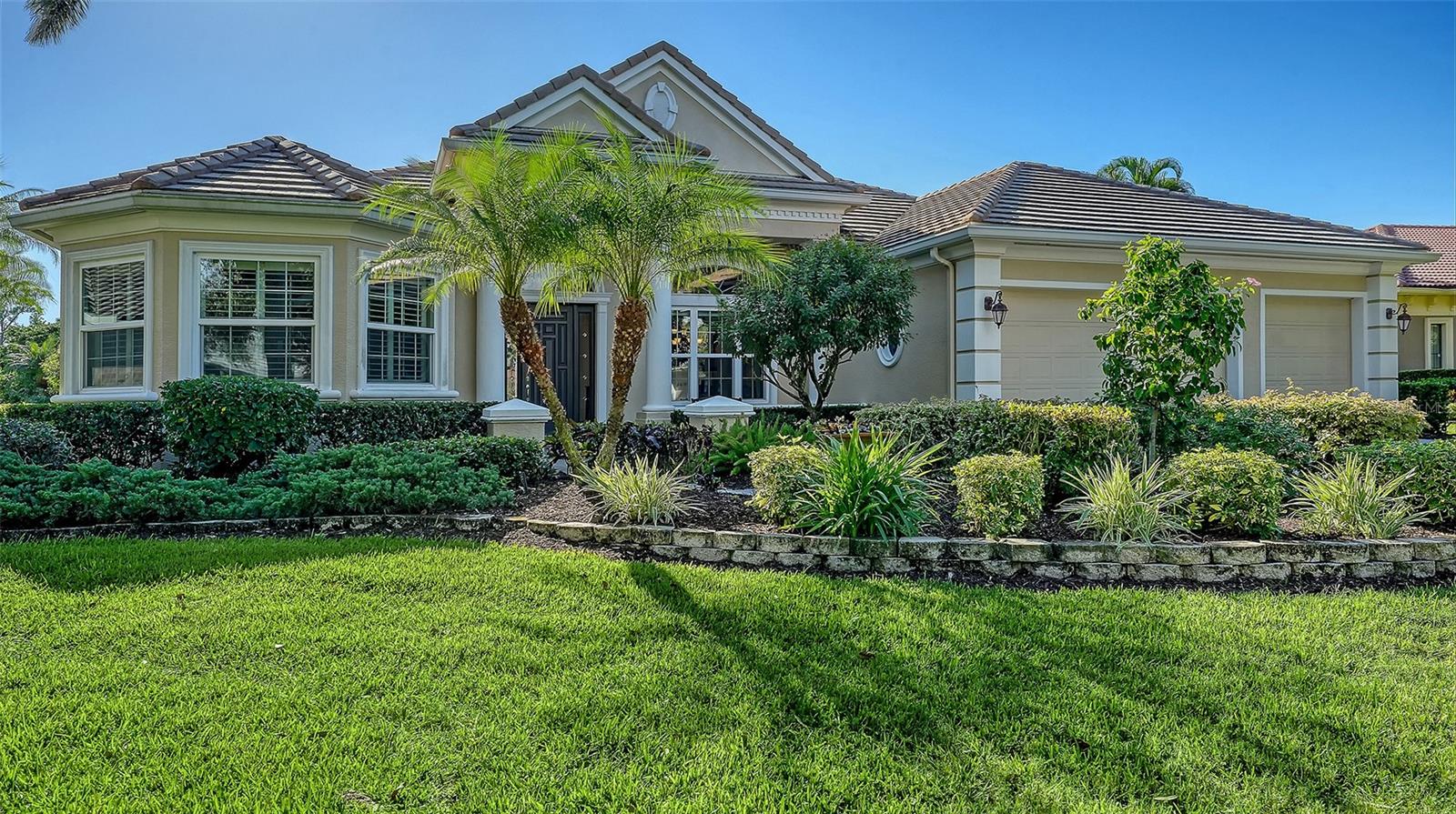 Architectural elegance abounds in this Todd Johnston custom built home in popular Silver Oak  on Palmer Ranch. Nearly 4,000 sq. ft. all on 1 floor. This home boasts of 4 bedrooms (one is a guest suite with private bath) 2 offices & 3.5 baths. Located on a private water front lot this executive pool home includes a new pool heater in 2022 with built in spa on expansive lanai & out door kitchen. Extensive use of popular brick pattern tile in the main living area with wood floors in the office & guest bedroom. 2 new AC systems smaller one replaced in 2019 & larger unit replaced in 2022.The sellers have replaced some of the windows with impact glass. Beautiful stone front gas fireplace in the living room. Upgrades to please the most discriminating buyer. Gourmet kitchen with wood cabinets, granite counters stainless appliances new gas cook-top. Seller to install new tile roof at seller's expense. The 3 car garage has an added 3 ft. in depth extension for additional storage.  Silver Oak is located on Palmer Ranch close to shopping, Legacy Trail & minutes to world famous Siesta Key Beach. All homes in Silver Oak were built by Sarasota's highest rated custom home builders.