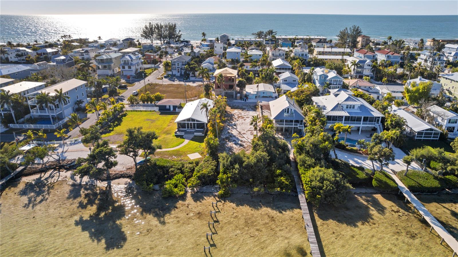 ~~~ PRICE DROP ~~~ The perfect piece of paradise ready for you to build your perfect beach house! Nestled on a very quiet street on the coveted island of Anna Maria. 9000 square feet of land for you to design everything you've ever wanted in a beach house.  Build a home that will take advantage of the opportunity for sweeping views of the intercoastal waterways. Design a pool and outdoor living space to die for Just lounging for the day or entertaining family and friends.  Imagine being able to walk out your back door, out onto your dock and board your boat to take an offshore fishing trip or just a leisurely ride around the islands. Have dinner at The Shore on the northern tip of longboat key via boat. You'll be close enough to the amazing beaches of the Gulf of Mexico where you can walk or take a bike ride and be there within minutes to enjoy some of the best sunsets on the planet. Spend the day at the beach and come home to cool off in your incredible custom pool. An additional opportunity exists, as the neighboring property to the south at 2308 Canasta, also a 9,000-square-foot waterfront parcel, is available from the same owner and may be purchased together. Combine both parcels for an extraordinary 18,000 square feet of prime Intracoastal waterfront—a truly rare chance to create something exceptional on Anna Maria Island.