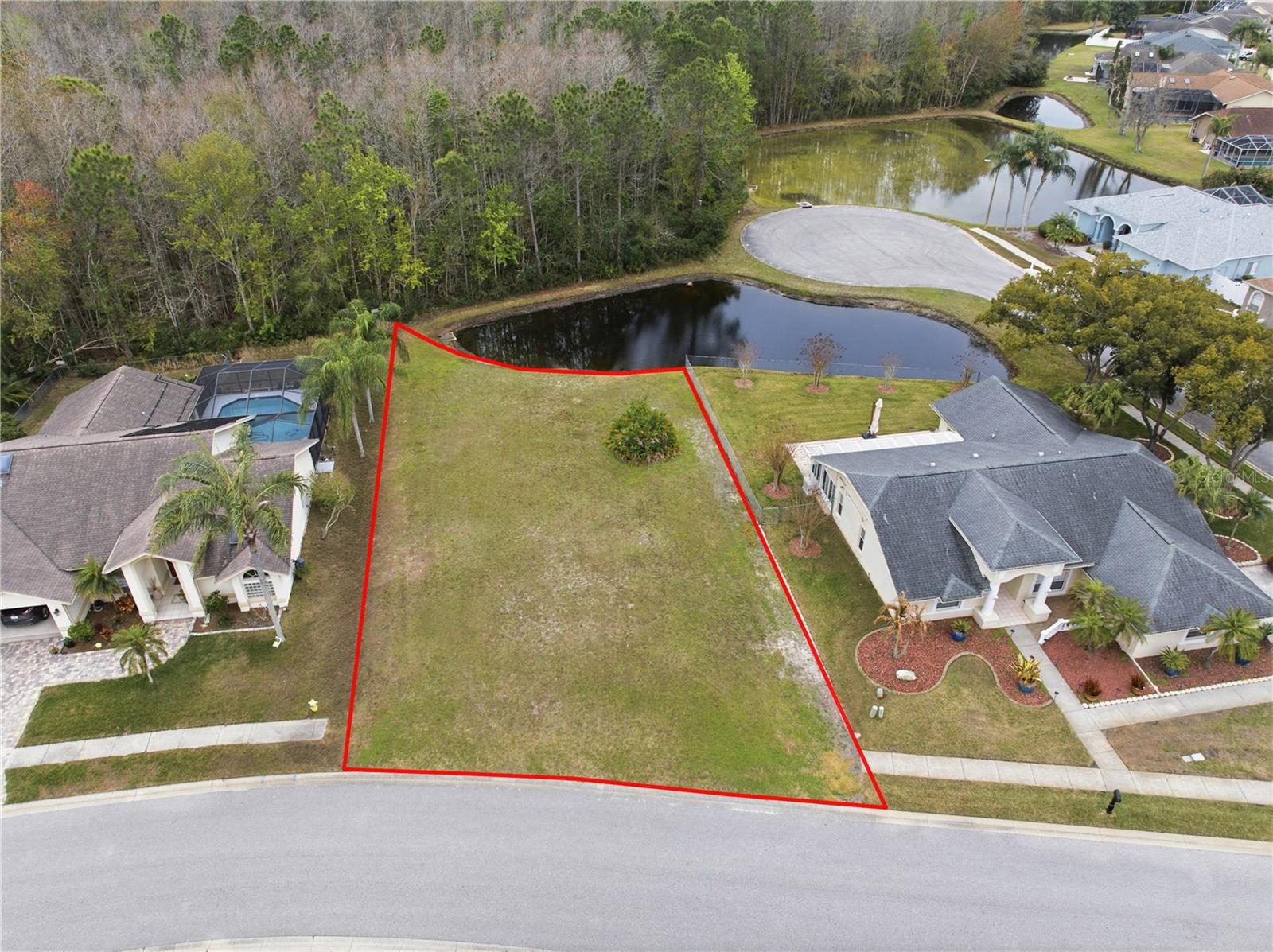 **MAJOR PRICE DROP** --The only lot available in Chelsea Place!-- Build your dream home on this beautiful .23-acre buildable lot located in a peaceful area of New Port Richey. This property offers a rare combination of privacy and natural scenery, featuring conservation land behind the lot and a tranquil pond view, creating a serene backyard setting with no rear neighbors.
Enjoy the beauty of Florida nature while still being conveniently located near shopping, dining, golf courses, and Gulf Coast beaches. With ample space to design the home you’ve always wanted, this lot provides the perfect opportunity for builders, investors, or future homeowners looking for a quiet and scenic homesite.
Don’t miss the chance to secure a buildable lot with water and conservation views in an established area of New Port Richey. A great place to bring your vision to life!