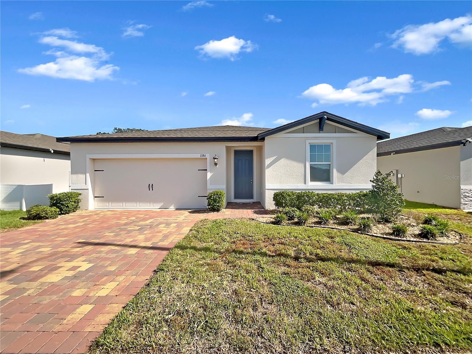 This stunning home offers a natural color palette and great flexible living space, perfect for any lifestyle. The kitchen is equipped with a center island and plenty of storage, while the primary bathroom features double sinks and great under sink storage. There is a sitting area in the backyard for relaxing and entertaining. This home is the perfect combination of style and comfort, and you won't want to miss it. Come take a look and fall in love!