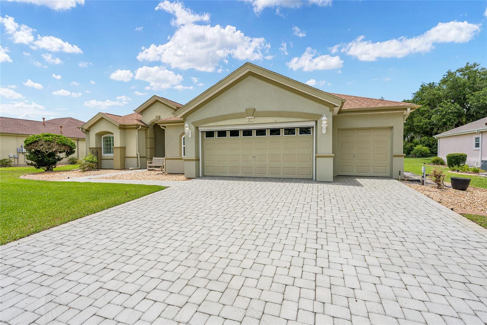 BACK ON THE MARKET - Inspection repairs completed - HAMPTON MODEL - situated on the 8th hole of the Heritage golf course. Re-shingled 2021, Both HVAC (2025), private irrigation well, water softener, tankless water heater, SOLAR 2024, REPLACED WITH WARRANTY 12 WINDOWS - 2023, inside laundry with additional wash tub, and the extended oversized garage. Spacious, updated Estate home in Del Webb Spruce Creeks Golf & Country Club. This Hampton is an entertainer's dream, all the easy to maintain, concrete curbed landscape lend to its curb appeal, the driveway and walkway have brick pavers, while the electric screen door with garage side entry and golf cart garage, make it easy to let in a cross breeze. The double entry doors have a tasteful iron door added, when you enter, you are greeted with soaring ceilings and 20" tile. The large open kitchen has recently been updated with newer ss appliances, 5 burner gas stove top, Bosch dishwasher, painted solid wood cabinets, moveable kitchen island, and stunning granite countertops and tile backsplash. All this opens to the family room which overlooks the golf course. Both the guest bedroom and den allow for plenty of guest space, the guest bath, has an easy entry shower. The owners suite has added space with the addition of the bay window. There are additional surprises, like the enclosed golf cart storage area, that has been turned into a workshop with plenty of cabinetry and it's heated and cooled. Weather its warm or cold, you will enjoy the acrylic double sized enclosed lanai, which is also heated and cooled with its own mini split unit.  make this a must see. Put this one on your list today to see the extensive list of updates. FURNISHER HAS BEEN REMOVED.
