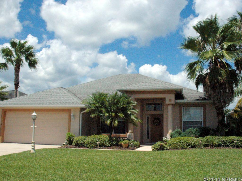 Enjoy the Florida Lifestyle in this Lakefront 3 Bedroom + Den, 2 Bath Pool Home in Islands of the Reserve at prestigious Spruce Creek Fly-In. Newly Renovated Granite Kitchen including Snack Bar, custom Bisque cabinets with soft-close drawers, Bosch dishwasher & all appliances included. Stylish Living Room has tray ceiling, surround speakers & sliding glass doors to the covered screened Lanai with an inviting Pool & Spa. Master Suite has a walk-in closet & sliders to the pool. Luxurious Master Bath includes soaking tub, separate shower, His&Her Vanity Sinks with under cabinet lighting. The split bedroom floor plan, with 2 additional bedrooms & bath, is ideal for family or guests. The Den/Bonus Room is located adjacent to the formal Dining Room in the front of the home. Extras included are New A/C, newer Gas Pool/Spa Heater, Irrigation Well & Sprinkler System, driveway with Extra Parking pad, Keyless Entry System on front door & Utility Sink in garage. Spruce Creek Fly-In is Americasâ Premier Fly In Community offering 24/7 security, optional membership to the Country Club with private Restaurant & Bar, Pool, Championship Golf Course, Tennis Courts & Fitness Center. The 4000â paved runway has a GPS approach, FBO, Aviation Fuel & Guest Plane Parking. Spruce Creek Fly-In has Restaurant, Hair Salon, Day Spa, community parks and fishing holes. We are close to shopping, schools & universities & World's Most Famous Beach. ;Water: City