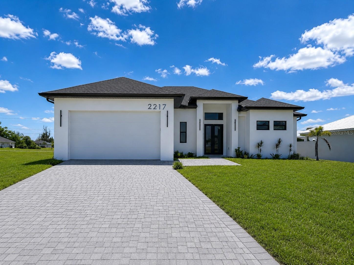 **CASH ONLY** HOME DOES NOT HAVE A CO (Certificate of occupancy), BUYER MUST OBTAIN A CO POST CLOSING**  Modern new construction opportunity in rapidly growing NW Cape Coral! This spacious 3-bedroom + den, 2-bath home offers over 2,100 square feet of open-concept living with soaring ceilings, abundant natural light, and a functional split-bedroom floorplan designed for everyday comfort and entertaining. The kitchen opens seamlessly to the main living area and features modern cabinetry, stone countertops, and a large island overlooking the dining and family spaces. The oversized primary suite includes dual vanities, a walk-in shower, and generous closet space, while the additional bedrooms and flex/den area provide versatility for guests, a home office, or playroom. Enjoy a covered lanai, indoor laundry room, and a desirable location surrounded by newer homes with easy access to shopping, dining, boating, and everything Cape Coral has to offer. Great opportunity to own a newer construction home in one of Southwest Florida’s fastest-growing areas!