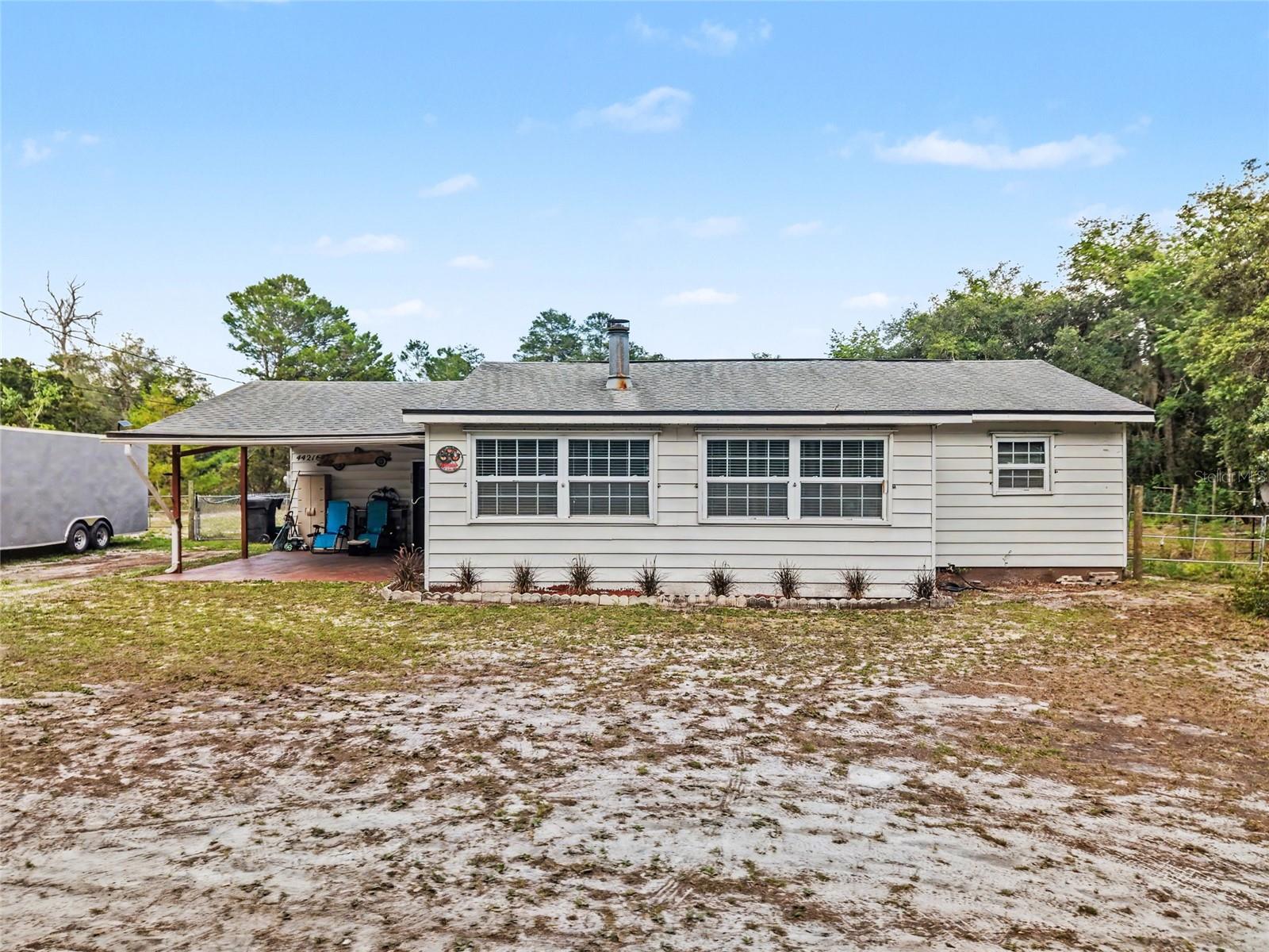 Bring your horses, boats, RVs, and outdoor toys! The property includes field fencing and plenty of outdoor space to enjoy country style living with no HOA restrictions. Yes, you read that right, horses are permissible here. Located near Lake Mack and the Ocala National Forest, this property offers space, flexibility, and access to Florida’s outdoor lifestyle.

The home features private well and septic, helping reduce monthly utility expenses while offering added independence and functionality. Enjoy peaceful surroundings with room for gardening, recreation, or additional outdoor storage needs.

Conveniently located near Downtown DeLand, Stetson University, natural springs, hiking trails, boating, fishing, shopping, dining, and major roadways. Whether you are searching for a primary residence, investment property, or weekend escape, this property offers plenty of potential and opportunity.

Schedule your private showing today to experience all this property provides.