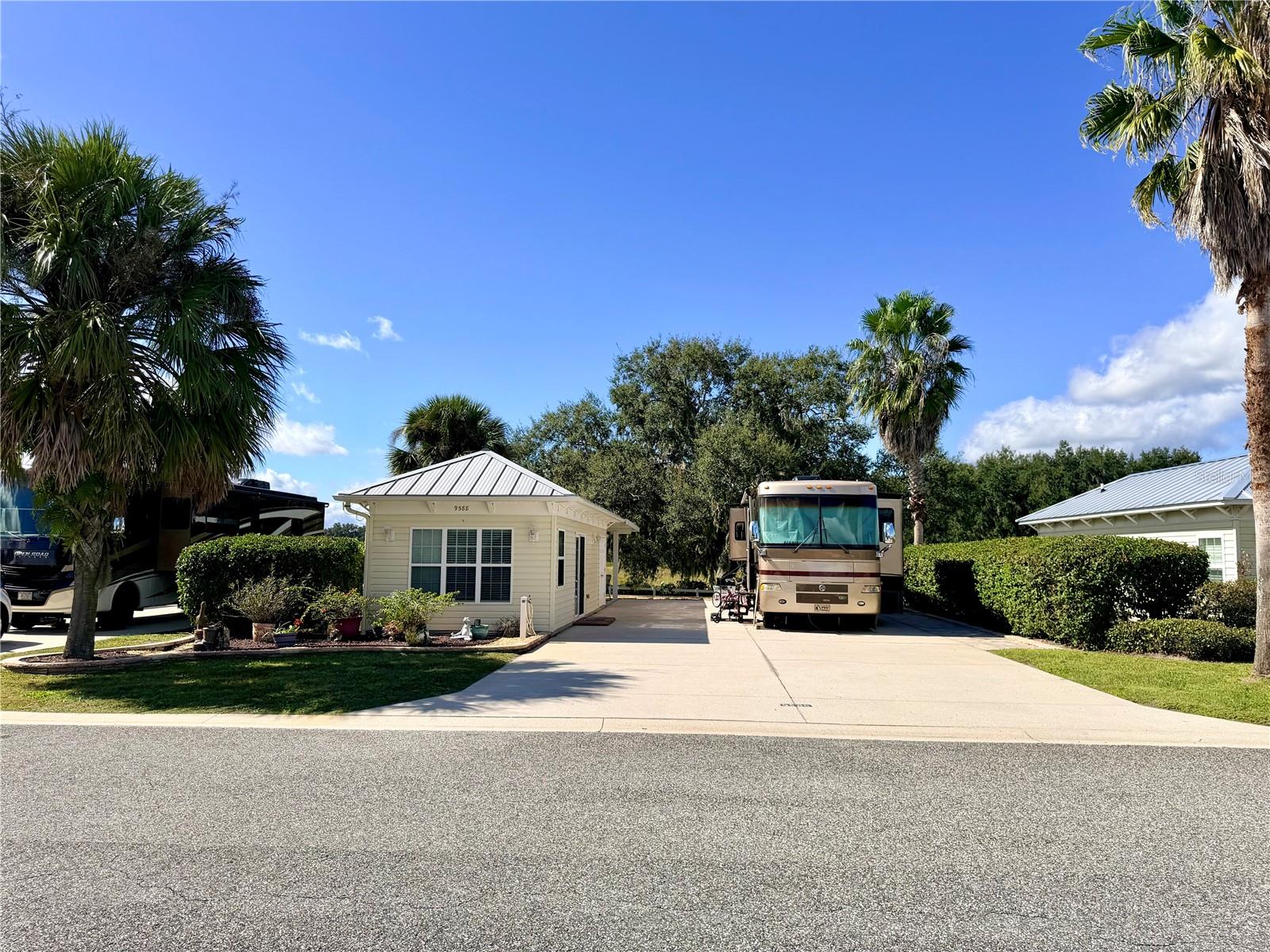 Big price improvement at Florida’s friendliest motorcoach resort, where neighbors quickly become friends 
and peaceful Central Florida living awaits. This 5,076 sq ft back-in, east-facing property 
overlooks a quiet cow pasture—your own front-row seat to stunning Florida sunsets from the 
12' × 16' covered pergola. 
The 26' × 76' concrete pad provides full hookups for your Class A or Super C motorhome, 
and the 384 sq ft furnished Grande Suite offers the perfect balance of comfort and style. Inside, 
enjoy tile flooring, a mini-split air system, and a kitchenette with granite countertops, full
size refrigerator, and an expandable island ideal for dining or workspace. The living area 
includes a pull-out couch—perfect for guests, and the full bath features a walk-in tile shower 
with glass doors, an oversized vanity, and abundant storage. The laundry room, accessible 
through a separate rear entrance, provides a washer/dryer, water softener, and extra cabinetry 
for organization. 
Located in Central Florida, this property offers the best of both worlds—no crowds, no traffic, 
yet close to countless day-trip destinations. From historic small towns and scenic springs to 
beaches and theme parks, there’s always something to explore—making this a favorite spot for 
visiting friends and family. 
Inside the resort gates, Florida Grande Motor Coach Resort offers a lifestyle that’s second to 
none. Enjoy a 20,000 sq ft clubhouse, fitness room, resort-style pool and spa, dog park, and 
eight pickleball courts. Stay as busy or relaxed as you like with trivia nights, happy hours, 
community dinners, yoga, bingo, and more—a full calendar of activities that makes this resort 
truly special. 
Find your peaceful retreat where comfort, connection, and community come together. Explore 
the life. Own the dream.
