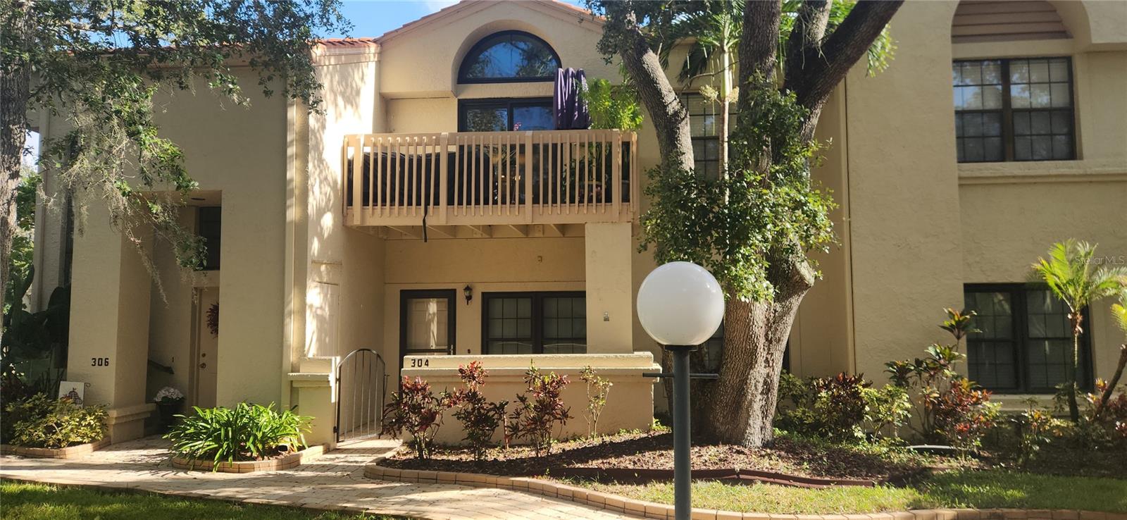 Major Price Improvement for this Safety Harbor Move in Ready gem! Fully furnished, so just unpack your bags and make yourself at home. Experience tranquil pond views from the front patio of this beautifully updated  condo in the desirable Los Prados community. This RARE 3-bedroom, 2-bathroom ground floor condo has been thoughtfully refreshed with new luxury vinyl flooring, fresh neutral paint, modern ceiling fans and light fixtures. Crown molding accents every room, adding an elegant touch throughout. Walking through the front door you will feel right at home, with a generous sized living room which is a perfect place to relax after a long day. French doors open to the second bedroom, offering flexibility as a guest room or home office with a built in desk area. The kitchen features a breakfast bar, stainless steel appliances with a good amount of cabinet and countertop space. The cabinets also have pull out drawers. The primary bedroom is located in the rear of the unit with double closets, and an updated bathroom with a walk-in shower. The third bedroom is located just down the hall and a great place for your guests to visit. The spacious inside utility room adds convenience to include a washer, dryer as well as bonus water softener. The open floor plan is perfect for relaxing or entertaining. Dining room table and chairs are accented by a beautiful modern light fixture. Enjoy resort-style amenities, including a community pool and hot tub.  Just steps from your door, enjoy direct private access to Folly Farms Nature Preserve, where scenic walking trails, community gardens, and opportunities to grow your own vegetables await. Located in the heart of Safety Harbor, this condo is close to shopping, dining, and the area’s charming downtown. Enjoy fresh brewed beer at Crooked Thumb Brewery and listen to live music in their beer garden. Enjoy a delicious meal at Bar Fly, the Tides Market, the Brinehouse on Main Street in Safety Harbor. Don’t miss this unique opportunity! Easy access to Tampa, St.Pete or Clearwater Beach. Welcome to Safety Harbor, Florida your new home!