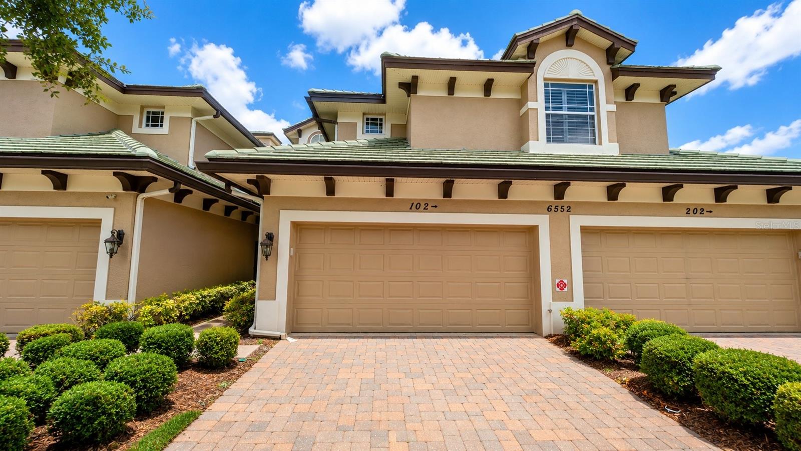 Annual / unfurnished Ground-Floor Villa in The Moorings at Edgewater – Lakewood Ranch Located in the highly desirable Moorings at Edgewater, this ground-floor villa offers 3 bedrooms, 2 bathrooms, an attached garage, and exceptional private outdoor living spaces. Enjoy a spacious open-concept floor plan with high ceilings, abundant natural light, tile flooring throughout the main living areas, granite countertops, stainless steel appliances, solid wood cabinetry, and a built-in office with upper cabinetry. The primary suite features wood-look tile flooring, a walk-in closet, and direct access to the screened lanai. The ensuite bath includes a dual-sink vanity, garden tub, and separate walk-in shower. Two guest bedrooms feature wood flooring and private access to their own paver courtyards. One guest room also includes custom built-in cabinetry and a workstation, making it ideal for a home office or flex space. One of the villa's most unique features is its outdoor living space. The primary suite opens to a screened lanai, while each guest bedroom has access to its own private paver courtyard, providing multiple outdoor areas for relaxing and entertaining. Residents of The Moorings at Edgewater enjoy resort-style amenities including a community pool, tiki bar, fitness center, bocce ball courts, volleyball court, clubhouse, boat club, scenic boardwalk, pavilion, grilling areas, and access to Moorings Point Island on Lake Uihlein. Conveniently located just minutes from Lakewood Ranch Main Street, Waterside Place, UTC Mall, Lakewood Ranch Medical Center, golf courses, parks, dining, shopping, and entertainment. Downtown Sarasota, St. Armands Circle, and the area's world-famous Gulf beaches are all within easy reach. This community has a homeowners association (HOA). The HOA charges fees for lease applicants, which may include application processing, background screening, common area deposits, and other applicable fees. Contact the listing agent for specific details regarding the HOA fees, application requirements, and approval process for this property.