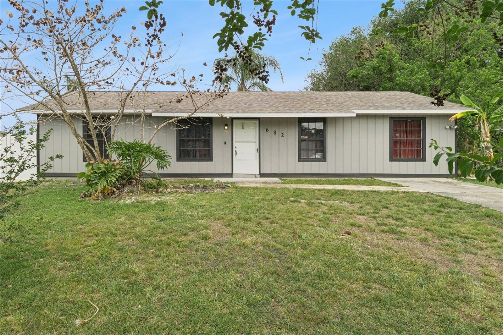 **This house comes with a REDUCED RATE through the seller's preferred lender. This is a lender-paid rate buydown that reduces the buyer's interest rate and monthly payment.**

Welcome to 682 De Groodt Road Southwest in Palm Bay, a newly remodeled 4-bedroom, 2-bath home offering a functional open floorplan and comfortable single-story living. The main living, dining, and kitchen areas connect seamlessly, creating a bright and inviting layout for everyday routines, gatherings, and entertaining.

Inside, the open design gives the home a practical sense of space, enhanced by recent updates that provide a fresh, modern feel throughout. There is plenty of room to relax, dine, and move comfortably between the shared living areas. The 4-bedroom layout provides flexibility for residents, guests, a home office, hobby room, or additional storage, while the 2 full bathrooms support daily convenience.

The backyard offers usable outdoor space with a small rear patio area just off the French doors, along with a fenced yard that provides room for pets, play, gardening, or future personalization. A backyard storage shed adds extra space for lawn equipment, tools, or outdoor items.

Located in Southwest Palm Bay, the home is set in a residential area with access to nearby schools, shopping, dining, parks, and major roadways. The location offers convenient access to everyday needs while keeping buyers close to the outdoor recreation, beaches, and Space Coast amenities that make Palm Bay a desirable place to live. With its recent remodel, versatile floorplan, and move-in-ready appeal, this home presents an excellent opportunity for a variety of buyers.