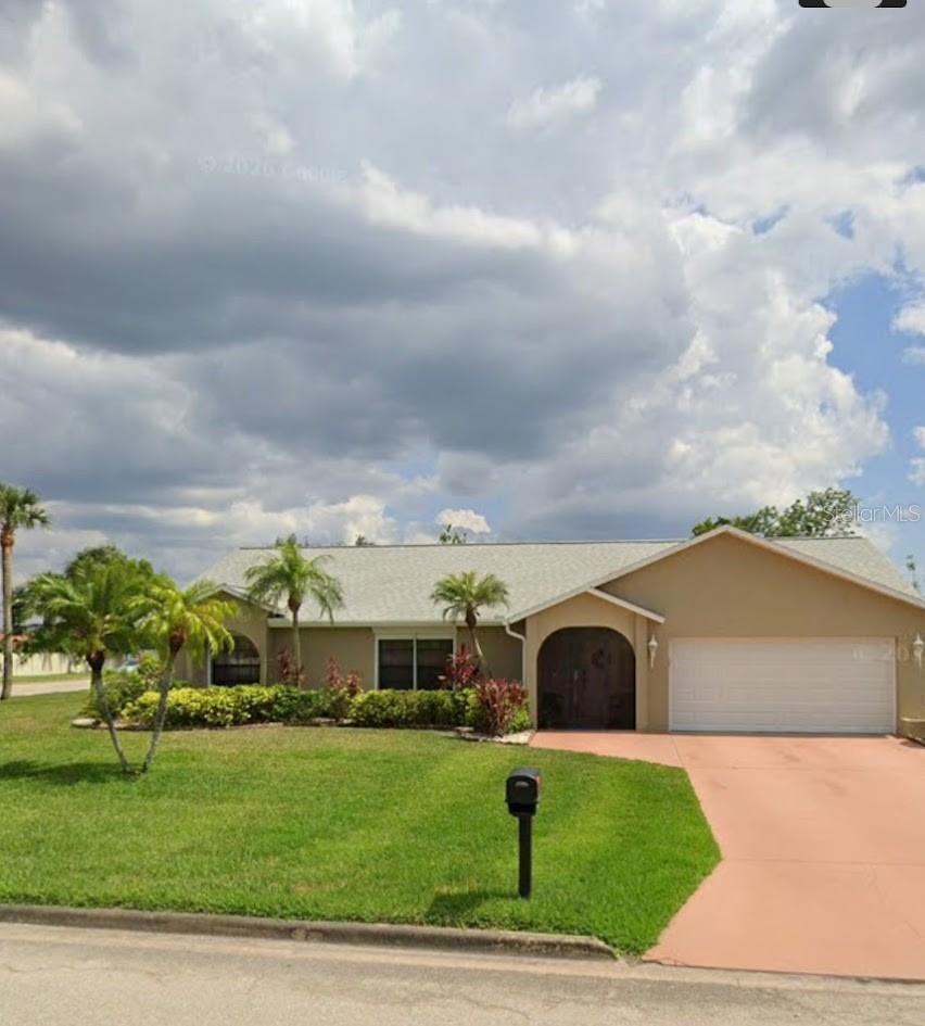 Charming custom home on an oversized corner lot (0.35 acre), located in the subdivision of Amberwood Estates. This split floor plan offers an L shape living/dining room area that leads to the Florida room. The fully equipped kitchen offers plenty of cabinet space, granite counter tops, and a breakfast nook with skylights for additional natural lighting. The primary bedroom offers a walk-in closet and an en-suite bathroom with dual sinks, granite counter top, and shower. There are two additional bedrooms plus a guest bath. Relax in the comfort and privacy of the Florida room; this space can be converted into another bedroom if needed. Neutral interior paint and ceramic tile throughout. Exterior paint and a/c done in 2/2026. Plantation shutters in all windows as well as electric hurricane shutters. This home is ready for a new owner, see it today!