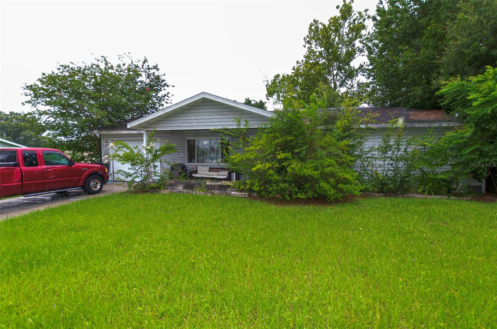 This charming 2-bedroom, 2-bathroom in the desirable 55+ community of Spruce Creek North offers a comfortable layout with plenty of potential to make it your own. Enjoy a spacious living area, a functional kitchen, generously sized bedrooms, and a screened-in patio that's perfect for relaxing or entertaining while overlooking the backyard. Conveniently located near shopping, dining, medical facilities, and major roadways, this property is an excellent opportunity for handy home buyers or investors looking to add value. With a little TLC, this home can truly shine—don't miss your chance to make it yours!