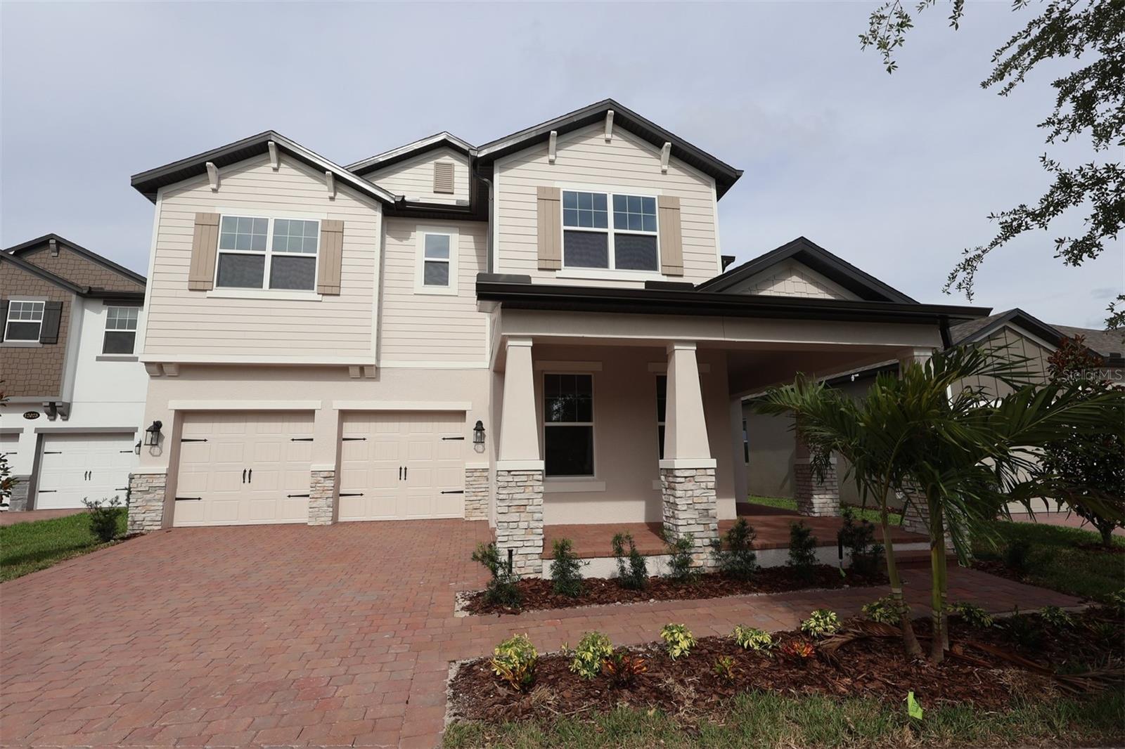 Welcome to 12033 Encore At Ovation Way in Winter Garden, Florida! This new construction home built by M/I Homes offers 2,740 square foot of thoughtfully designed living space with 4 bedrooms and 3 full bathrooms.

The functional floorplan offers versatility for a variety of lifestyles while maintaining a cohesive flow throughout the home. The home's design balances aesthetic appeal with practical functionality, creating spaces that are both beautiful and livable.

This beautiful two-story home features an open-concept living space perfect for entertaining and family gatherings, a first-floor bedroom, a versatile loft space, a wrap-around front porch, an extended covered lanai, and a 2-car garage.

Located upstairs off the loft, your owner's bedroom provides convenience and privacy with its en-suite bathroom and large walk-in closet.

Experience the comfort and style of new construction without the wait. This move-in ready home offers the perfect opportunity to start fresh in a brand new space that hasn't been lived in before.

Schedule a viewing today to experience firsthand what makes this Winter Garden home special!