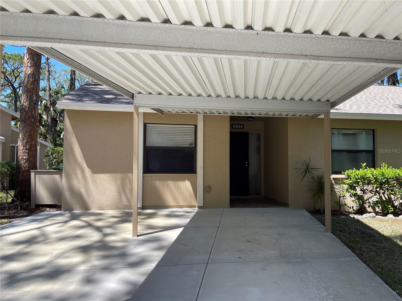 WELL-MAINTAINTED TWO BEDROOM AND TWO BATHROOM VILLA WITH VAULTED CEILING.  HUGE KITCHEN which features a pantry, laundry closet, breakfast counter and gas range.  Spacious dining/living room for your next gathering with your friends and family.  There is a large service window between the kitchen and the dining area.  The lanai with the glassed sliding doors and screens has relaxing views of the backyard.  Enjoy the view of the greenery and sip on your favorite beverage.  This home has ample light and is also a split floor-plan.  The main bedroom boasts a walk-in closet and the  bathroom has a walk-in shower.  By the side of the villa there is a storage unit for your convenience.  The carport is covered.  Village Gardens is a hidden gem in Sarasota and the amenities are pickleball, tennis and shuffleboard courts, heated pool with new furniture, Ramada with gas grills, utility sink and seating area, clubhouse with fully equipped kitchen, library and billiard table, lots of guest parking spaces as well.  There is a manager on site.  The grounds, exterior, roof are all maintained by the HOA.  Take part in the vibrant social calendar activities and meet your neighbors/your new friends.  Ride your bicycle or walk and enjoy the lush landscaping.  Easy access to I-75 and just under 5 miles to Downtown Sarasota.  St. Armand's and Lido Beach  are about 15 minutes drive and on your way to the beach enjoy Ringling Bridge and the vast views of the bay.  There are cultural and culinary venues close by, such as the Ringling Museum, Sarasota Opera, UTC Mall and more.  The North Water Park is just around the corner with trails, a playground and covered seating areas for you and your four legged friends.  Spend the day at the beach in Siesta Key with the dreamy sand and turquoise water of the Gulf.  Live and work here all year around, have your villa as your vacation home, or as an investment property.  Book your showing today.