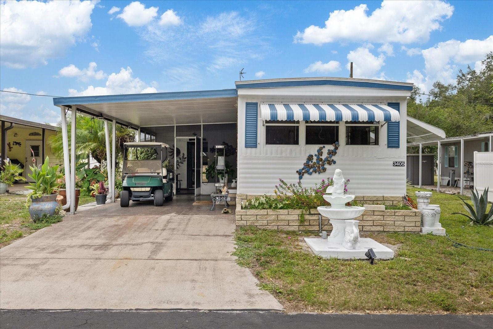 TURNKEY/FURNISHED 2BR/1BA in Terra Siesta Co-Op just steps from the pool and clubhouse. Updated in 2019 including white cabinet kitchen, bath, open living area, lanai, large primary bedroom, and TWO sheds including insulated workshop/laundry with sink, shelving, and washer. NEW A/C (2026), WASHER (2024), and ROOF (2020). Beautiful irrigated tropical yard with bananas, papaya, kumquat, flowers, turf sitting area, and solar motion lights throughout exterior. LOW FEES include water, sewer, and trash, plus extensive community amenities. Walk to restaurants, shopping, and plazas. Just 16 miles to Anna Maria Island, 12 miles to Sarasota, and 25 miles to downtown St. Pete. Sold furnished with décor, appliances, TVs, grill, smoker, and EZGO golf cart with 4 NEW batteries for community golf cart parades. Terra Siesta is a great place to be in a rapid growth area of Florida, also do enjoy the best beaches in the world. Electricity bill ~$60/month and water/trash/sewer covered by HOA.