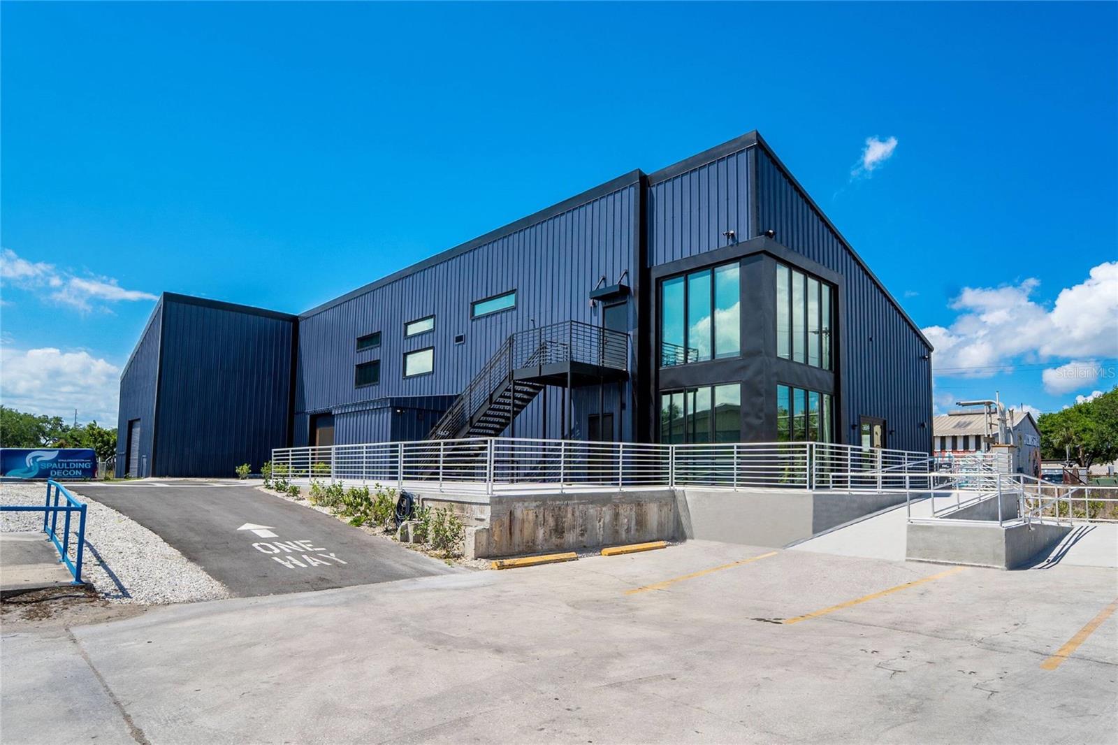 One or more photo(s) has been virtually staged. One or more photo(s) has been virtually staged. Florida Commercial Group presents 3605- 3615 E. 7th Avenue. This property consists of a 4-building portfolio of 5 available spaces. Ready for occupancy is an oversized warehouse and 2 office buildings, one of which features an adjoined warehouse space. The entire property has been completely renovated from top to bottom and spans 1.19 acres offering 255’ of direct frontage and signage on east 7th Avenue. A rare investment potential or owner/ user opportunity, this property offers many occupancy options: a new owner may occupy both offices and warehouses, or all of the buildings may be leased out individually or as a collective, or the owner may occupy part of the property and lease out the remaining buildings. The choice is yours. There is plenty of onsite parking and the entire property is fenced. The IG zoning of this property provides excellent flexibility for distribution, manufacturing, mixed use, a workshop and or storage. Included in the purchase of this unique industrial package is Building A: 3,432 SF and currently tenant occupied by a long-standing Bakery tenant. This tenant signed their NNN lease in 2017 for 15 years with 3% yearly increases. Building B offers a move-in ready, oversized, 6k SF newly renovated, high- end office with all the bells and whistles. There is plenty of natural lighting throughout and lots of office suites for staff or private workspaces. This building features top quality, full renovations to the kitchen and offices. There is also a gym onsite along with updated restrooms and private showers. Affixed to this office at the rear of building B is a 1K SF warehouse that may be used in conjunction with the 6k SF office. Located at the back of the property and adjoining building B is a 4K SF warehouse considered building C. This building boasts +33’ ceiling heights and 2 grade level roll up doors. A wide-open layout and is also move-in ready. Directly across from building C is building D, a fully renovated 2K SF office building that is move-in ready and boasts 3-4 offices, a kitchen/ breakroom and plenty of onsite parking. The current owner can vacate at the close of purchase allowing an investor to select a new tenant at market rate and terms or to allow for an owner/ user to grow their assets and operate their own facility. Florida Commercial Group can stay on as property manager for the new owner. Both office buildings are fully furnished. Call today for a showing and additional details.
